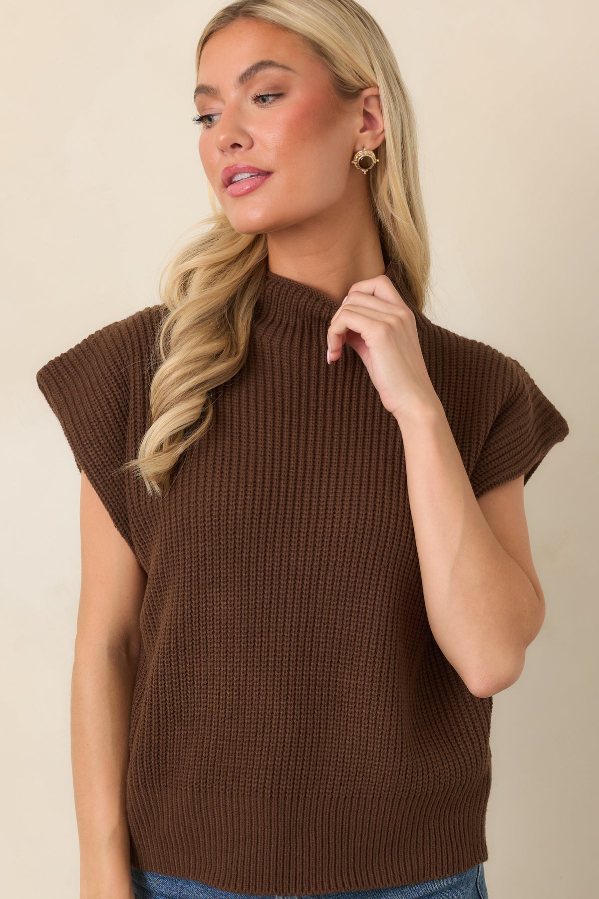 Cozy ribbed top showcasing the relaxed bodice and wide hem that creates subtle definition at the waist.