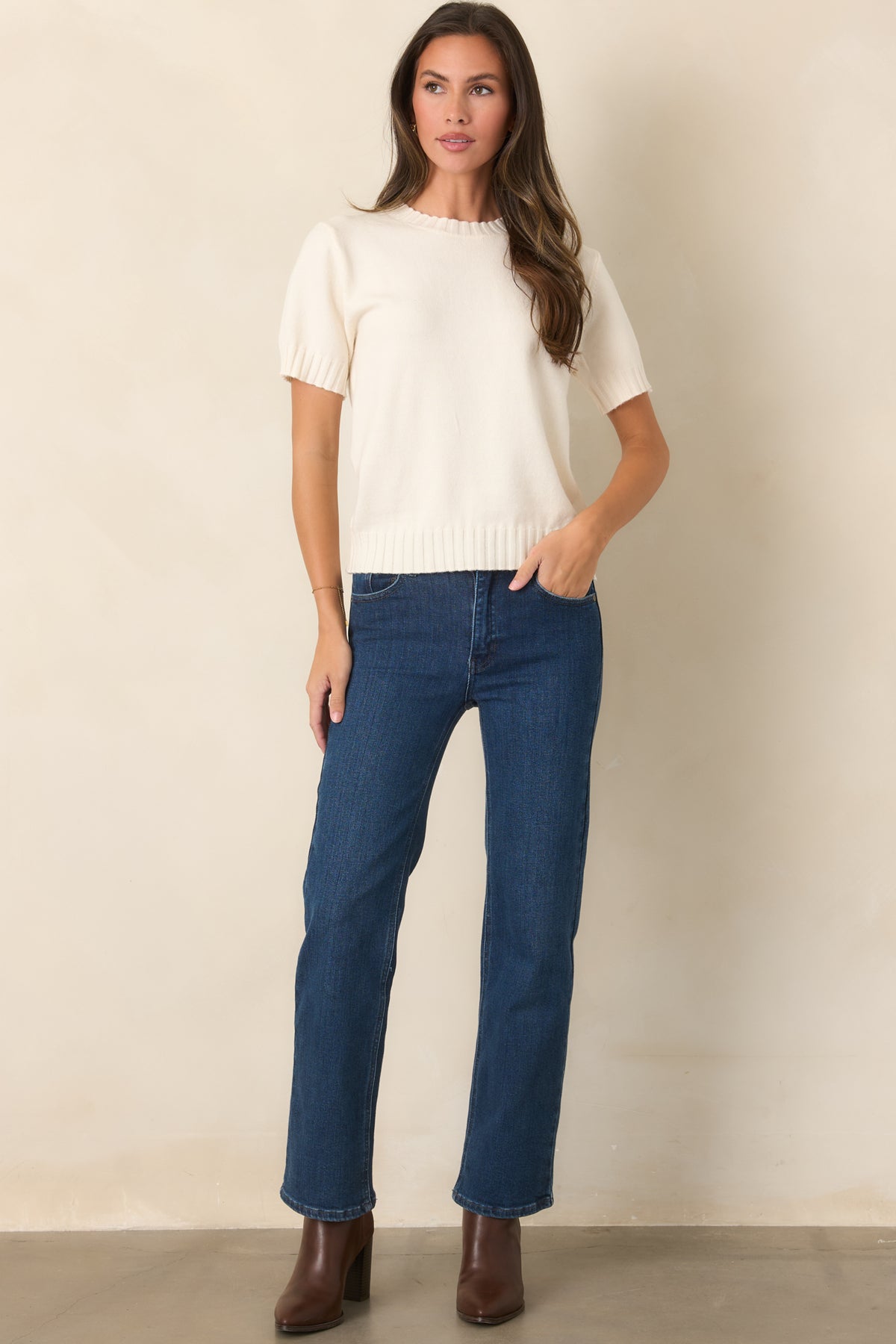 Creamy ivory wool-blend knit top featuring a classic crew neckline, short sleeves, ribbed trim, and a relaxed fit.