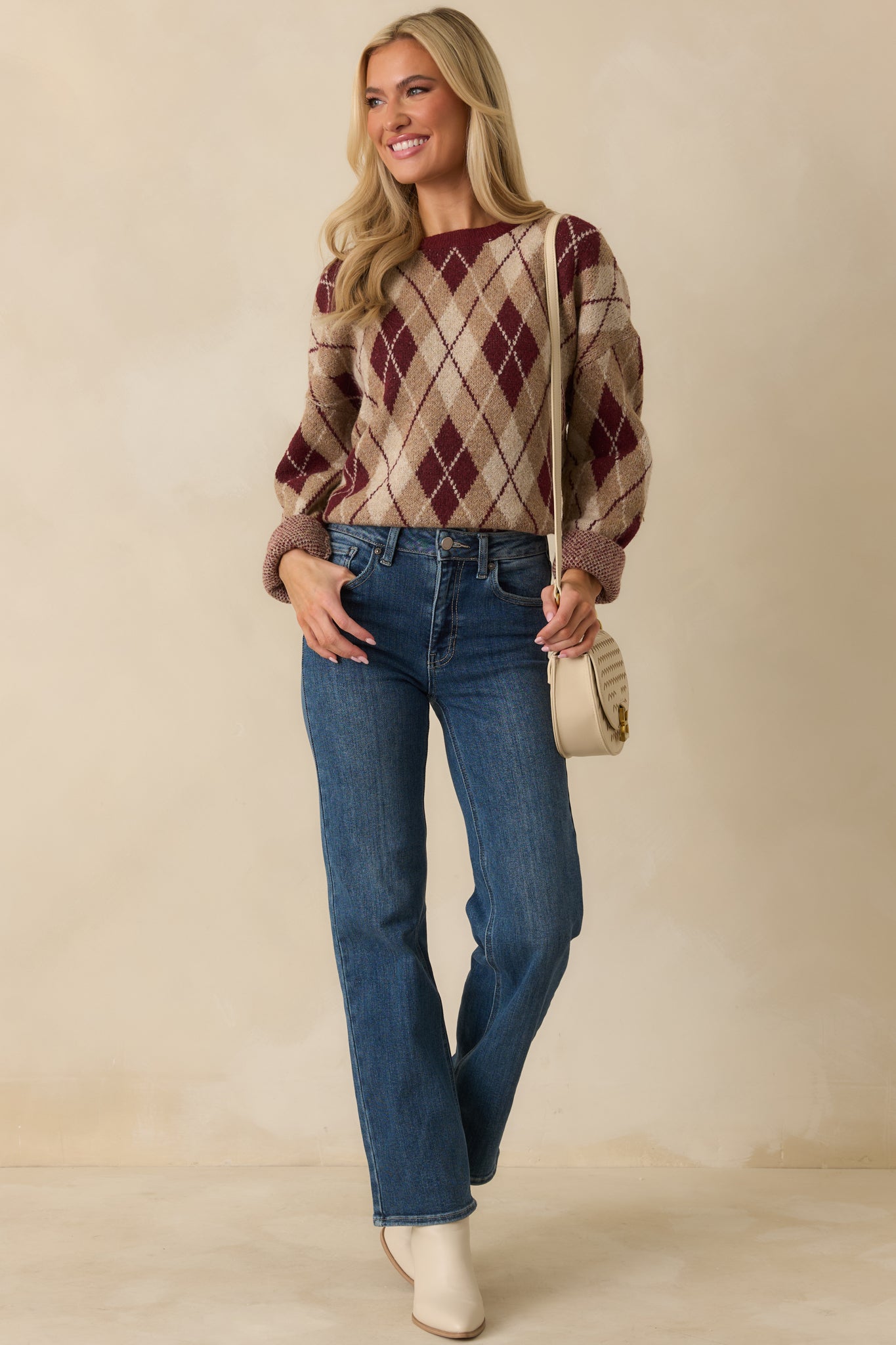 Crew-neck sweater displaying long sleeves and a comfortable, loose silhouette.