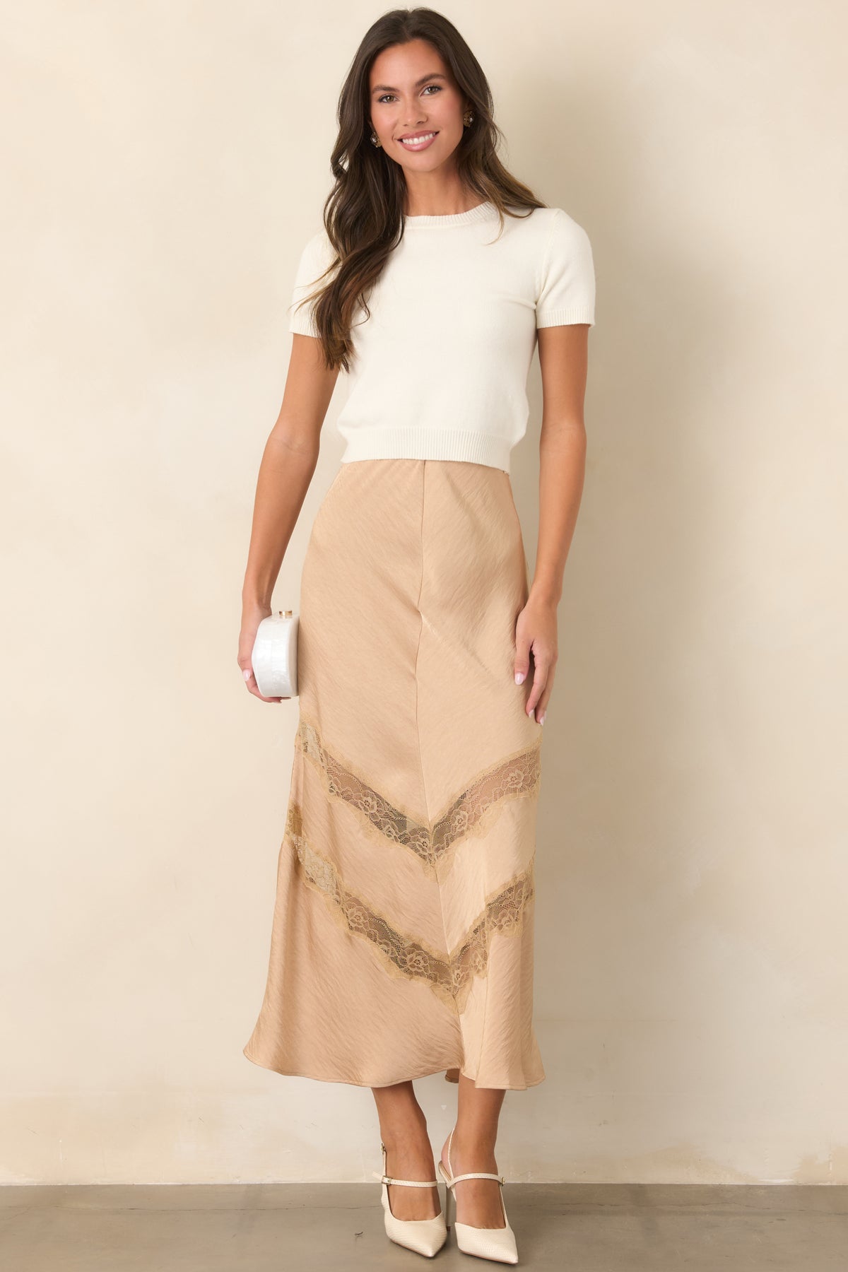 Crinkled tan skirt featuring a fitted waist and feminine lace accents through the lower skirt.