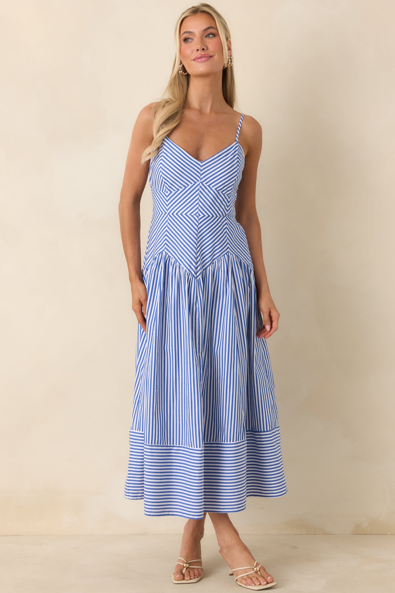 Crisp blue and white striped dress with flattering fitted top and airy skirt.