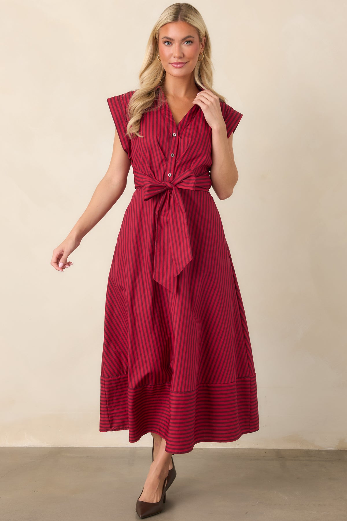 Crisp cotton dress showcasing mixed stripe placement, a collared neckline, cap sleeves, and a defined waist.