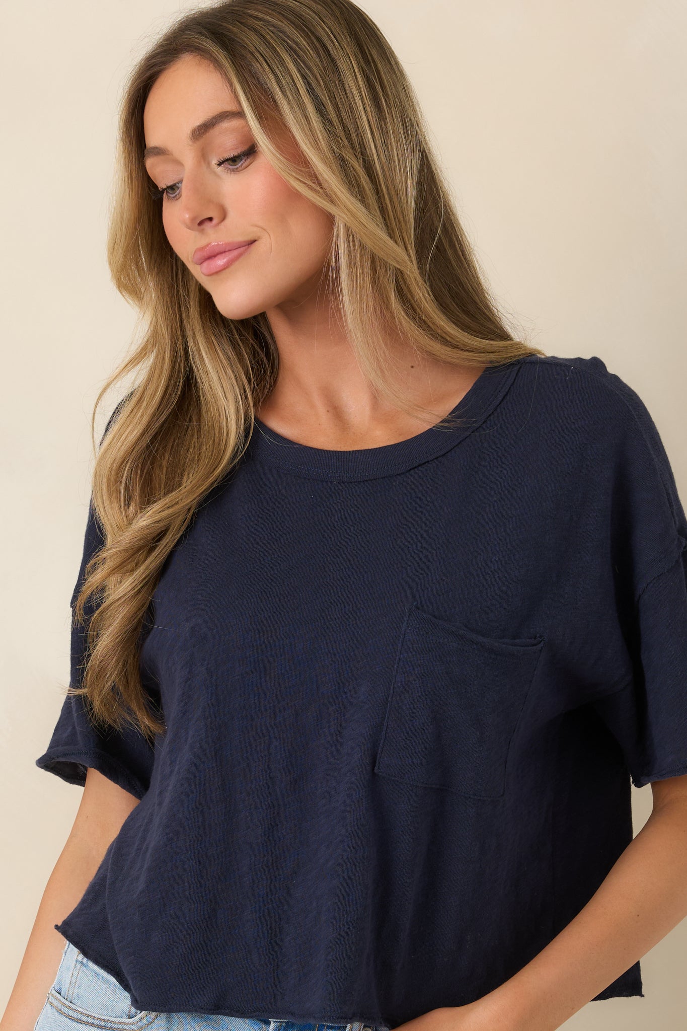 Close-in crop highlighting the cotton fabric texture and short sleeve design.