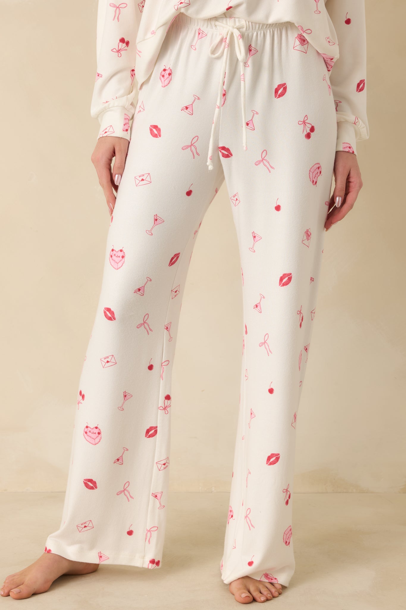 Cropped view showing the allover pink novelty print and relaxed fit