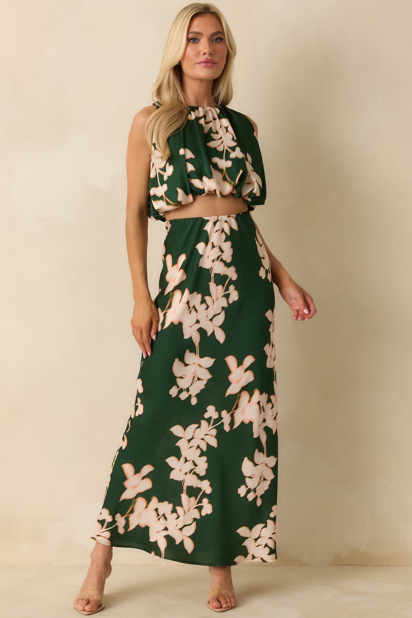 The crop top displays its gathered detailing and full lining, creating a smooth, structured fit with subtle sheen.