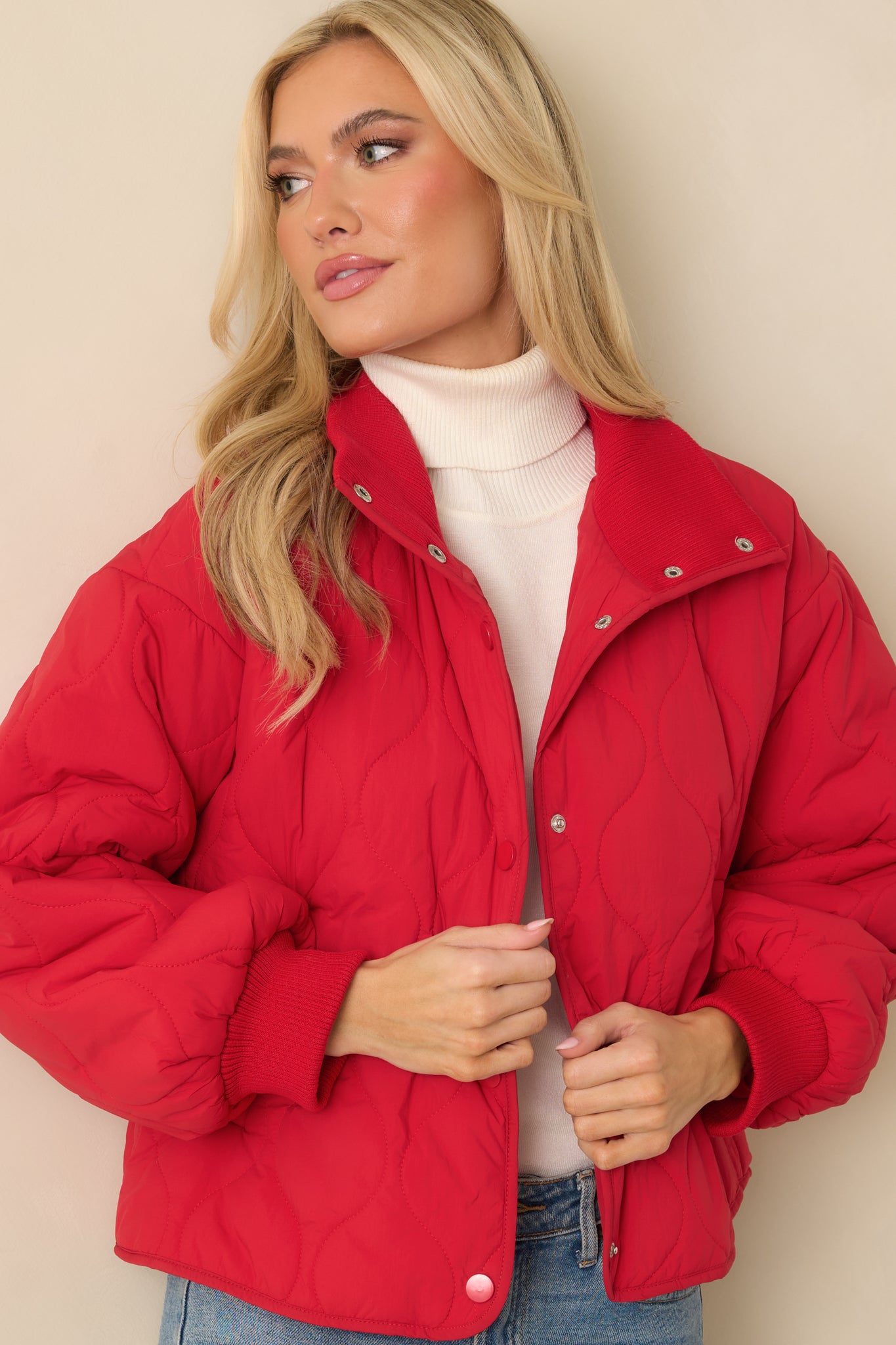 Cropped angle highlighting the ribbed cuffs and sleeve quilting detail.