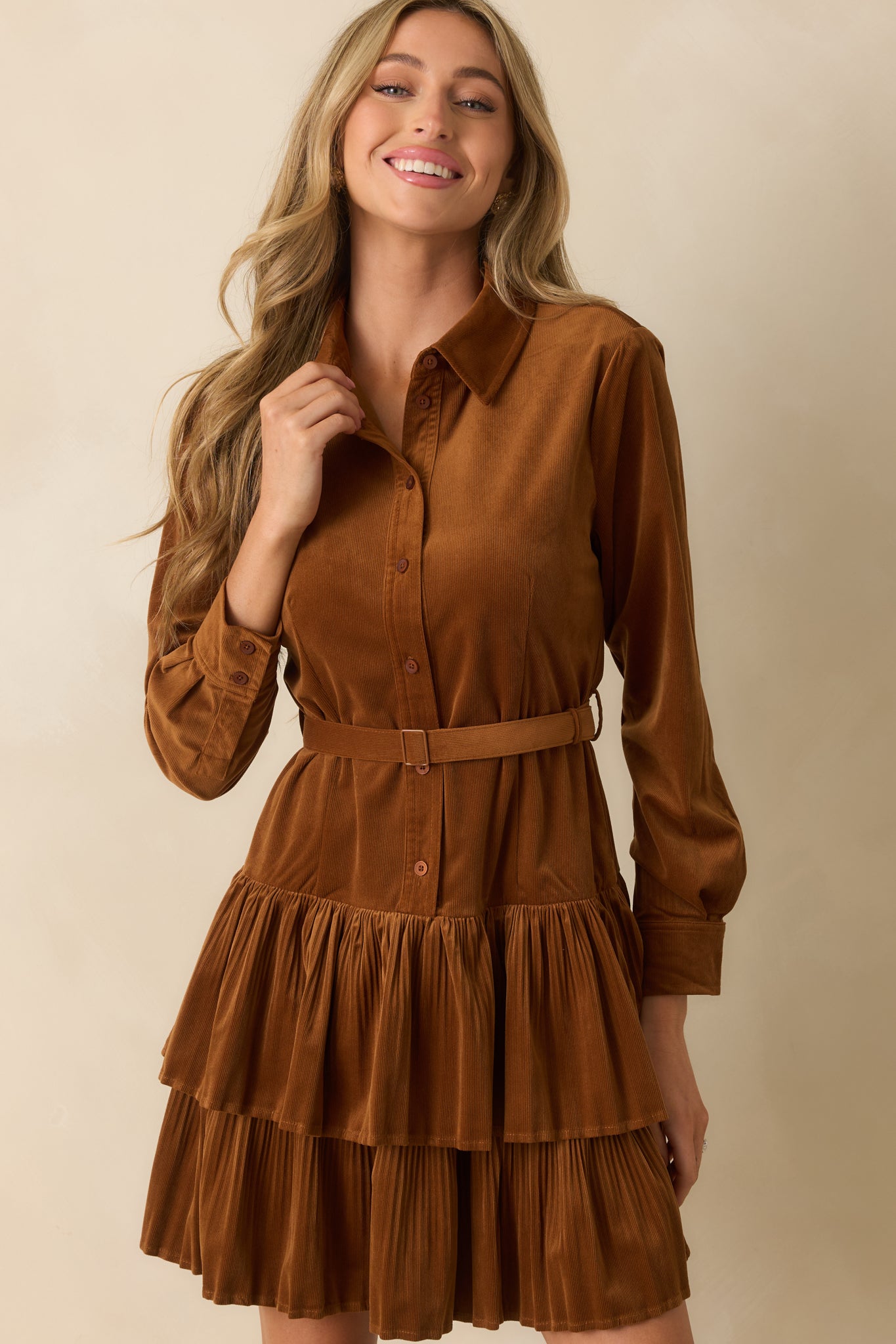 Cropped view of bodice showing buttons, collar, and soft textured fabric.