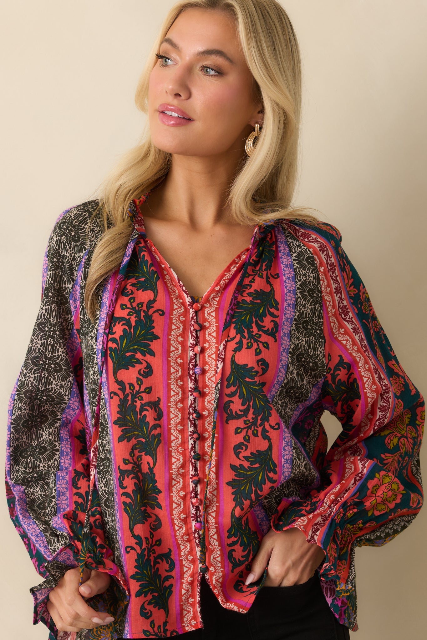 A cropped chest-level view emphasizing the patchwork pattern and neckline detail.