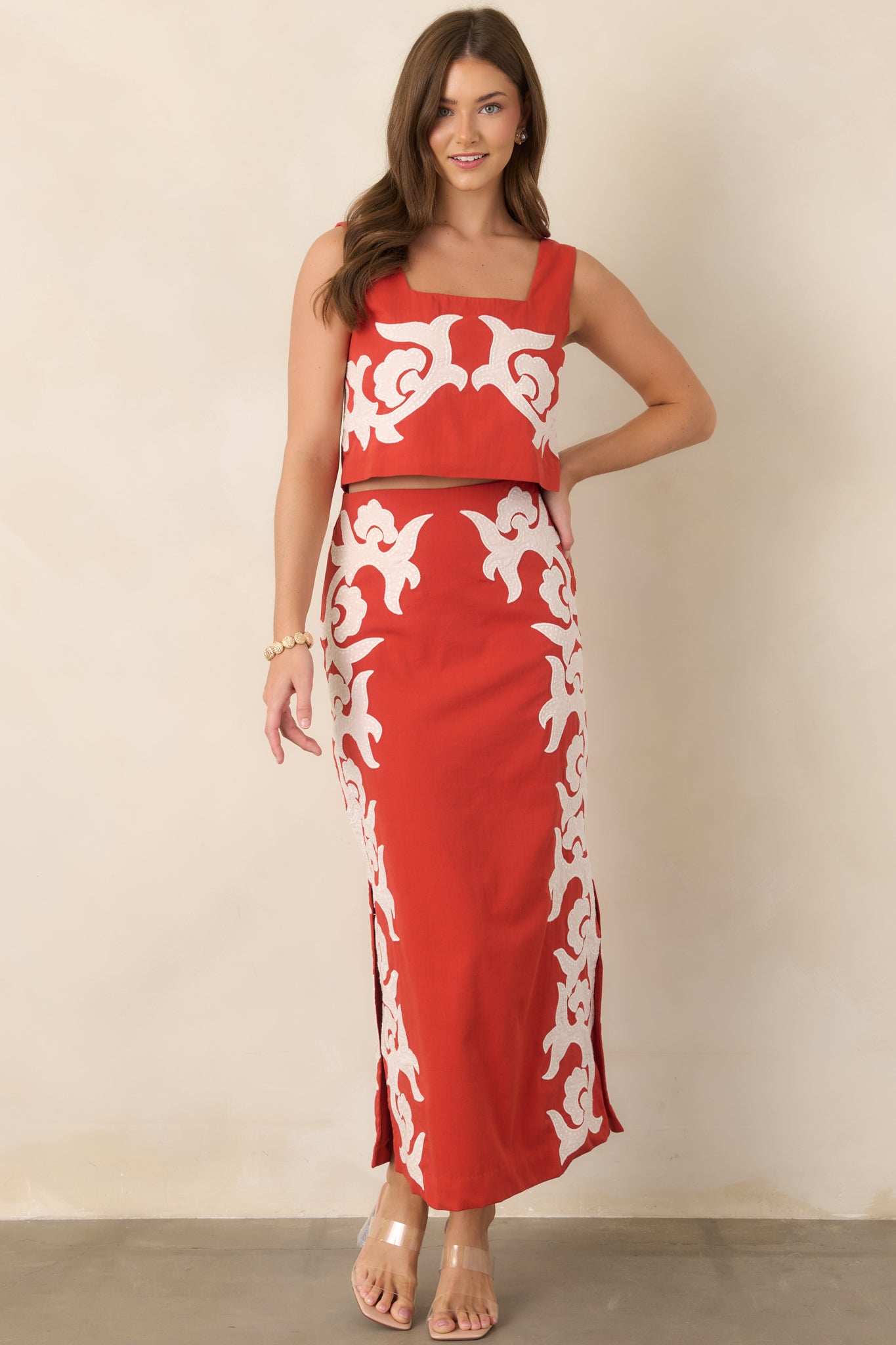 Short cotton top showcasing its square neckline, substantial shoulder straps, and streamlined cropped shape.
