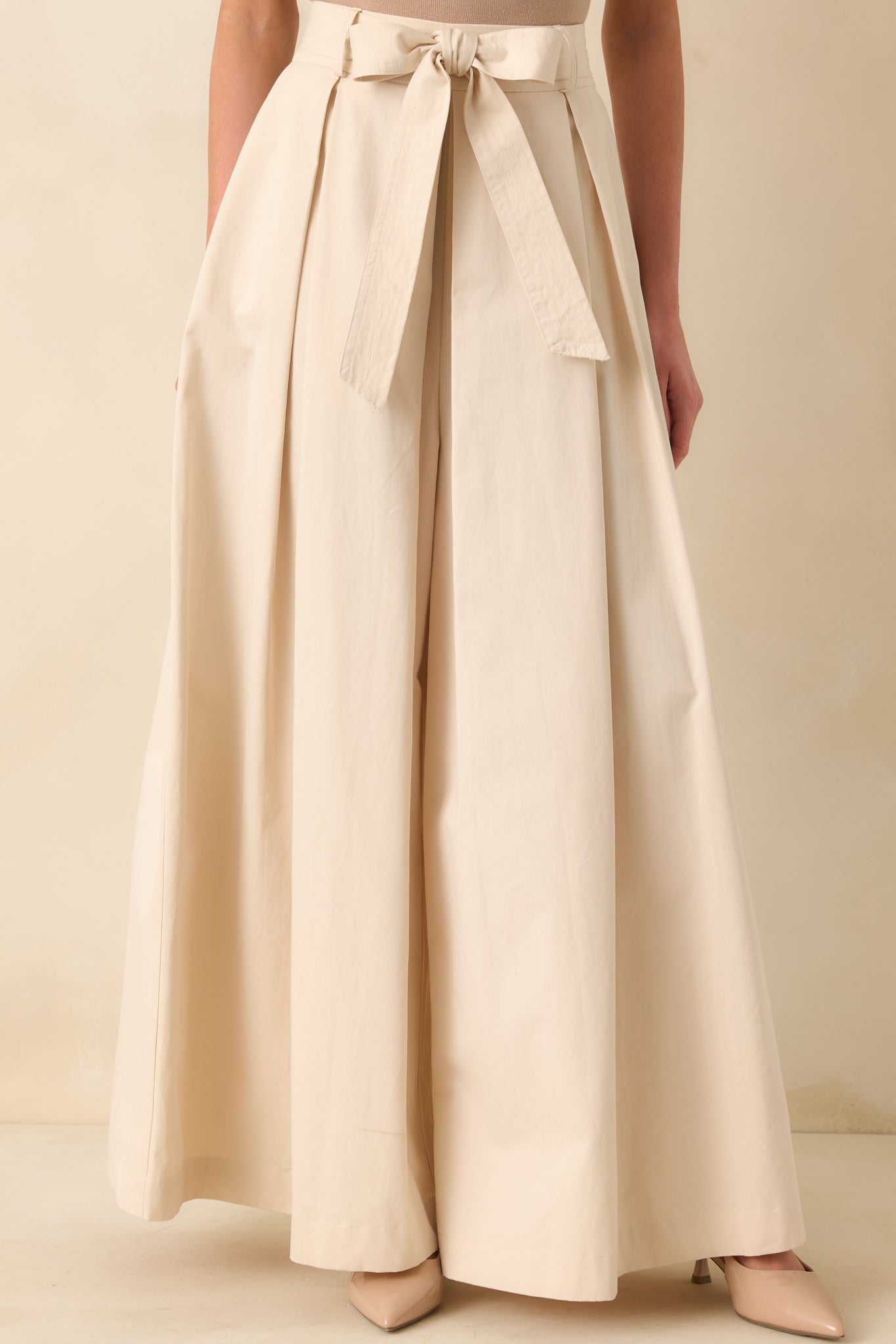 Cropped front view focusing on the waistline and self-tie belt detail.