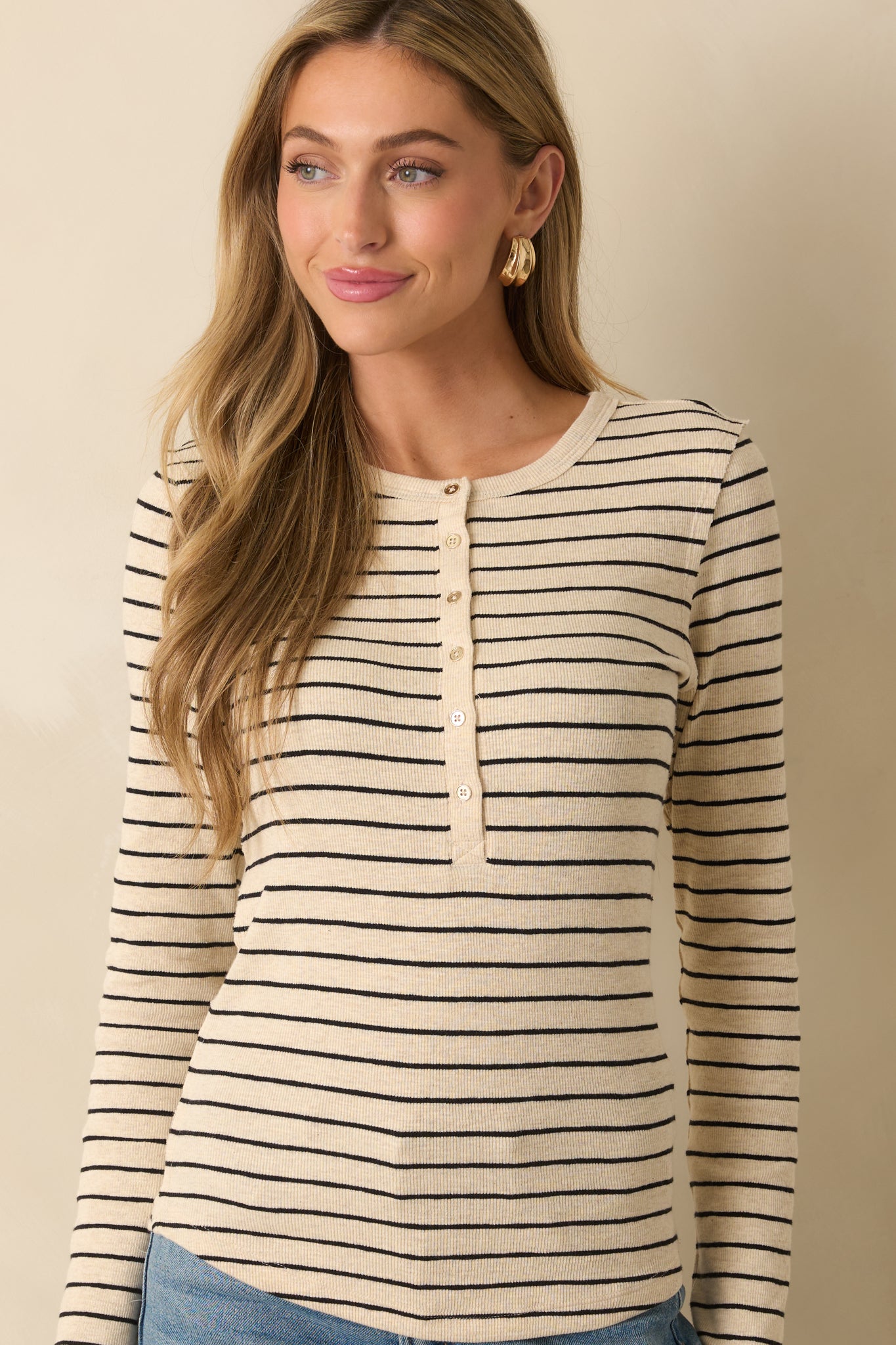 Cropped front view focusing on the round neckline and top portion of the button placket.