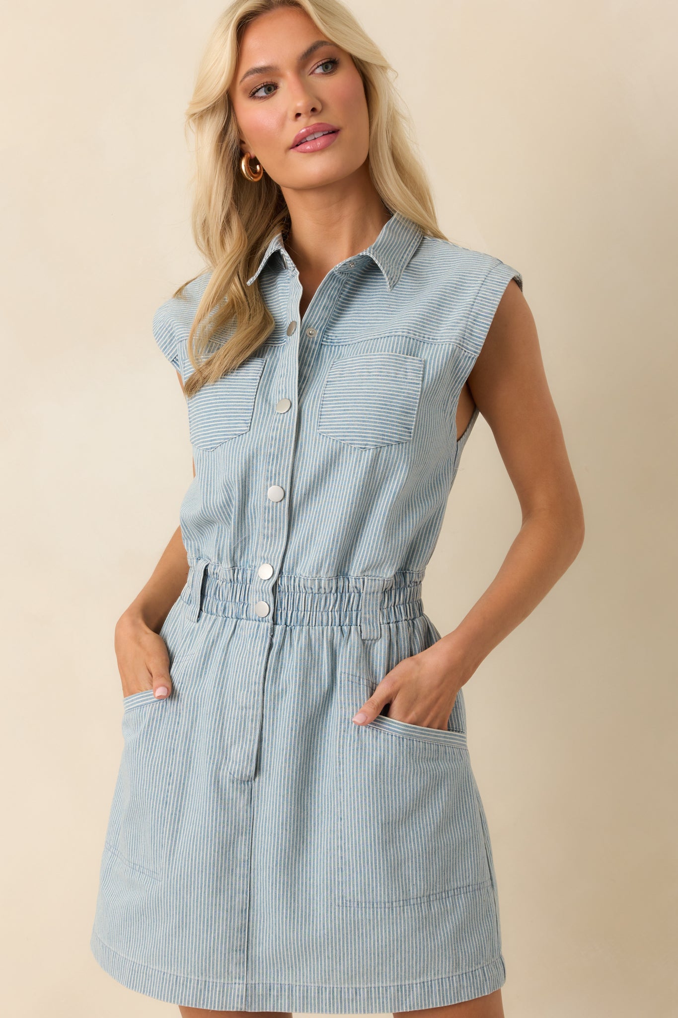 Front-facing cropped shot focusing on collar, pinstripes, and button-front details.