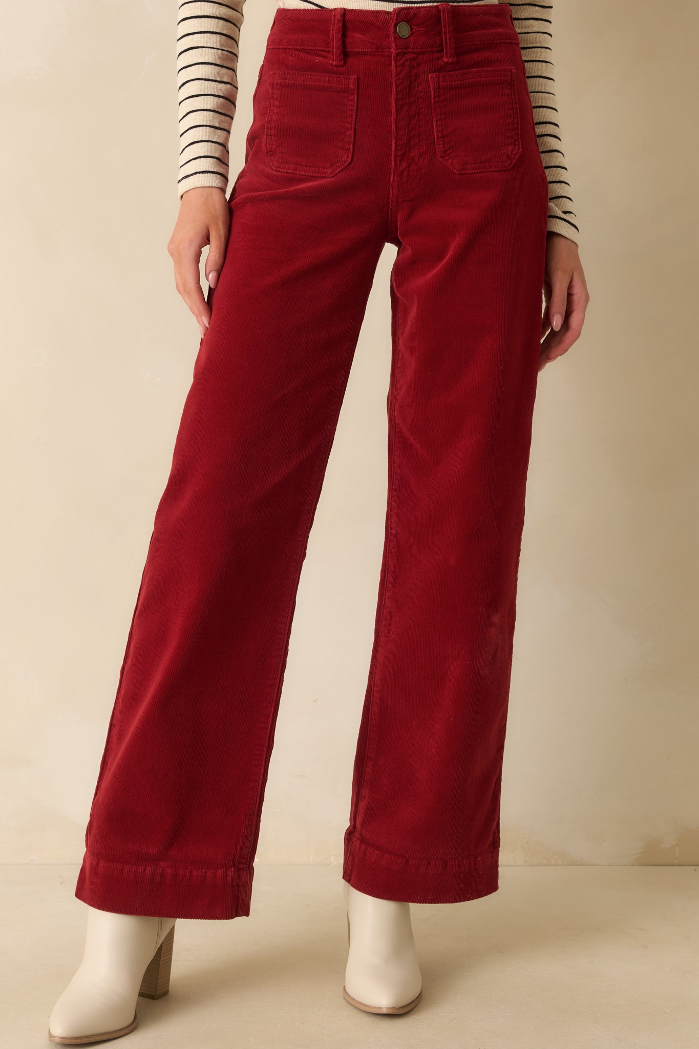 Cropped front view capturing the corduroy texture and the high-rise waistband detail.