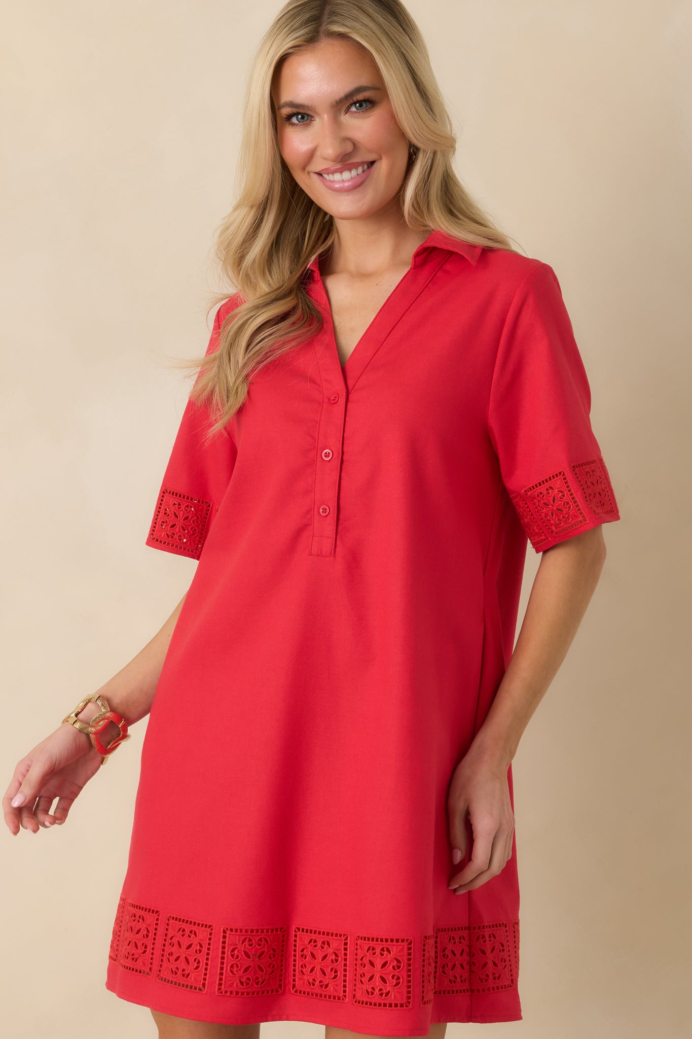 Cropped front view focusing on the collared neckline and partial button-front closure.