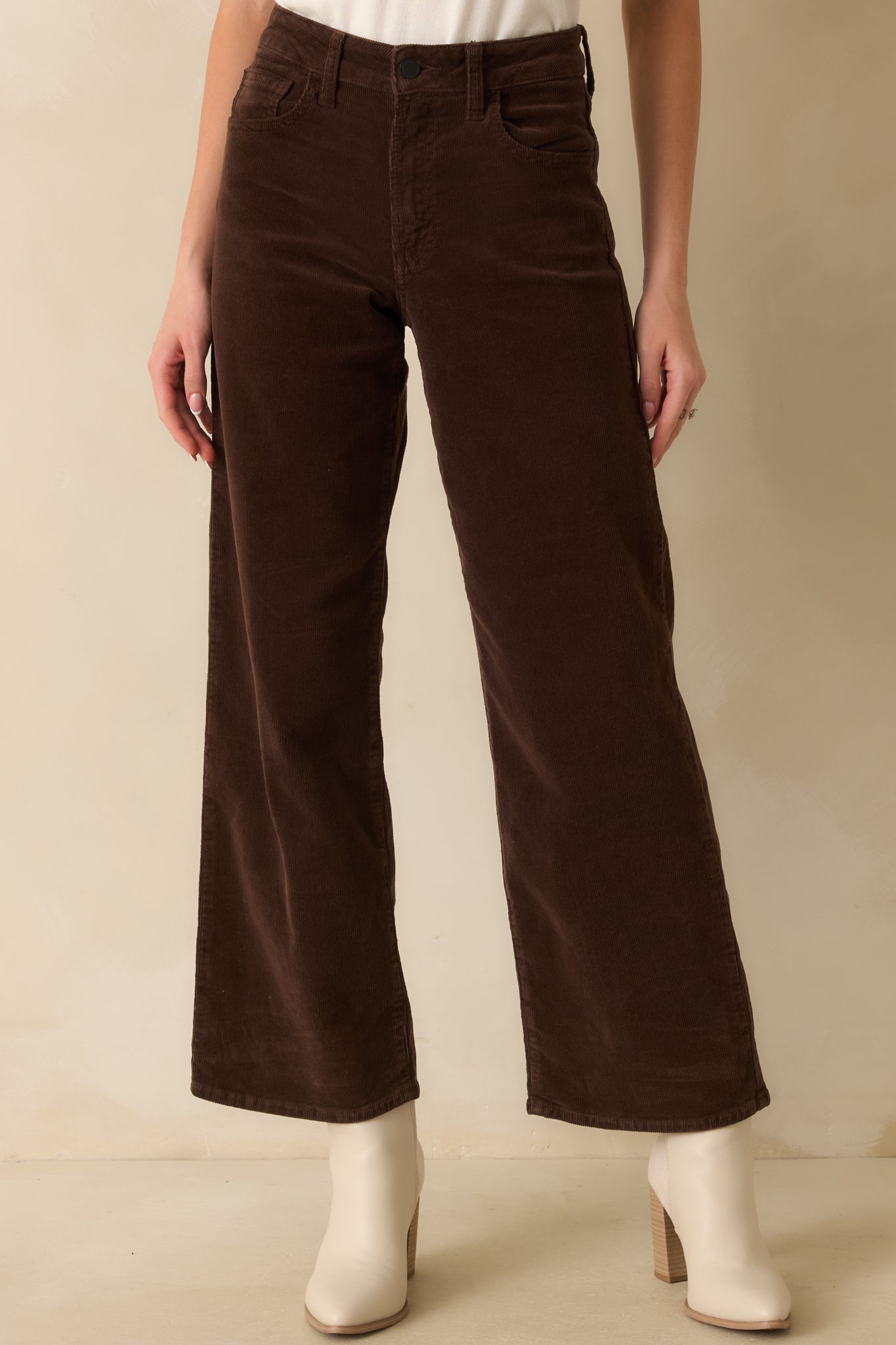 Cropped front view highlighting the high-rise waist and zip fly with button closure.