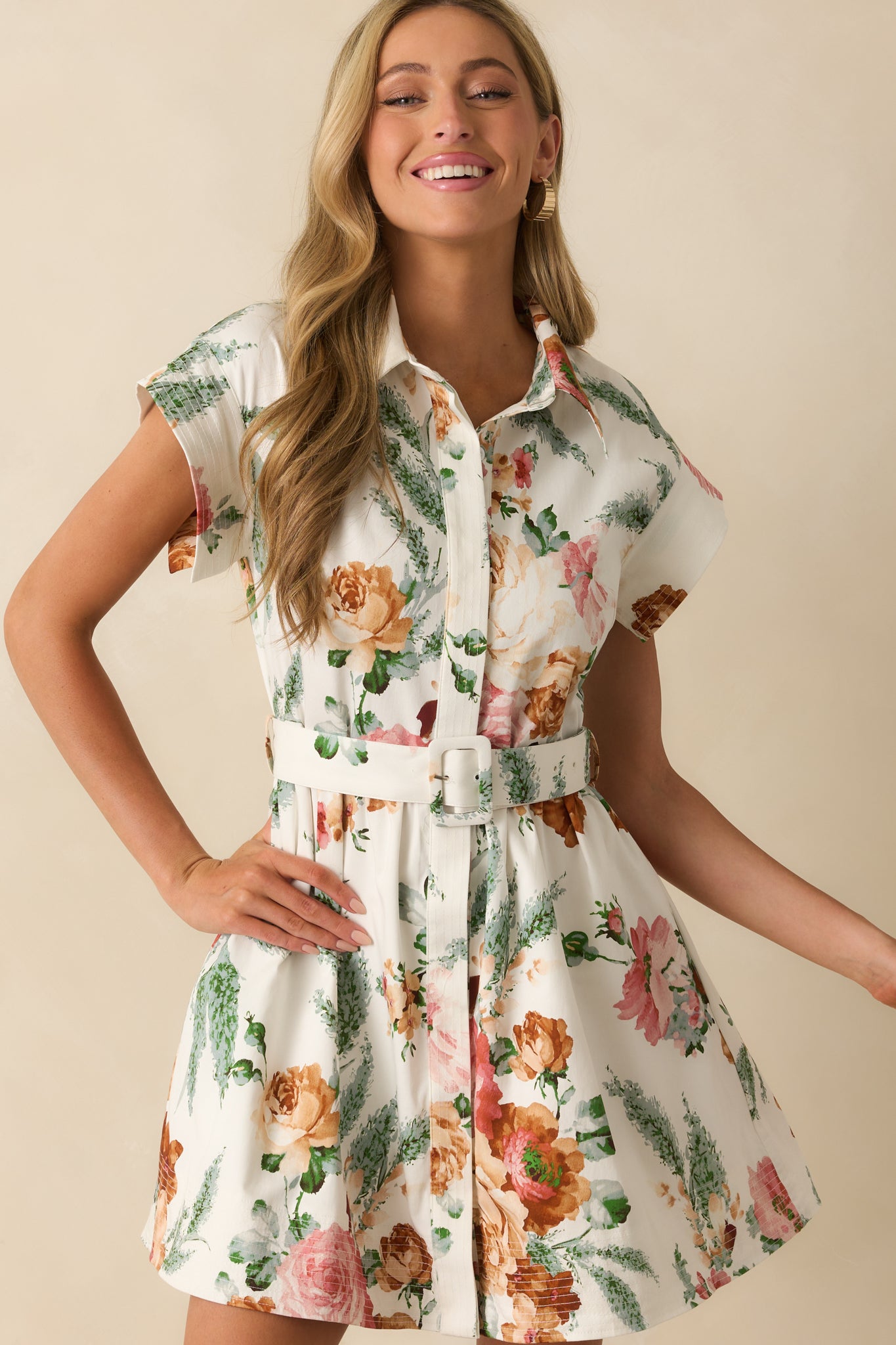 A cropped front view of the mini dress focusing on the collared neckline and floral print details.