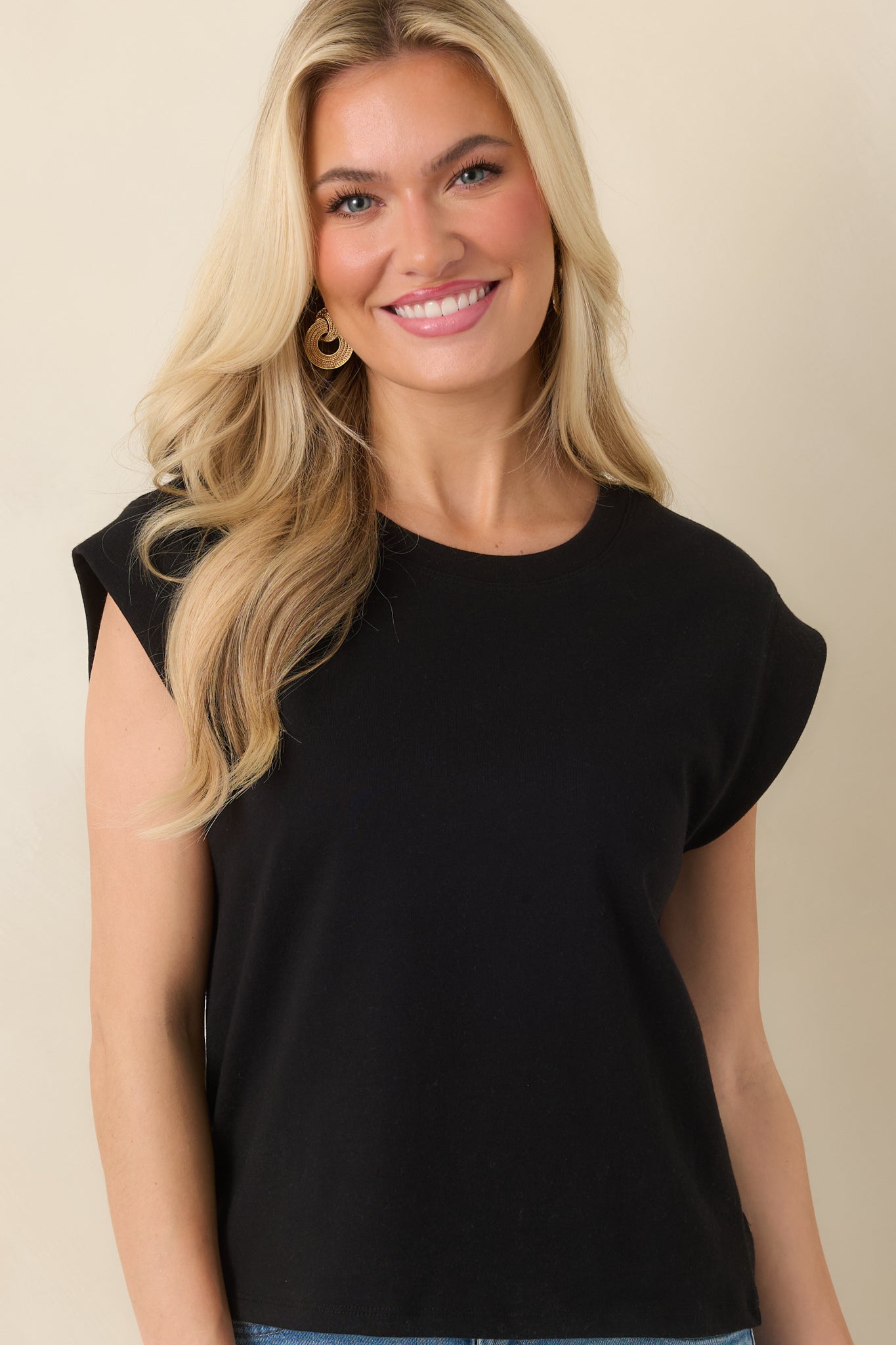 Cropped front view of top showcasing relaxed silhouette and clean hemline.