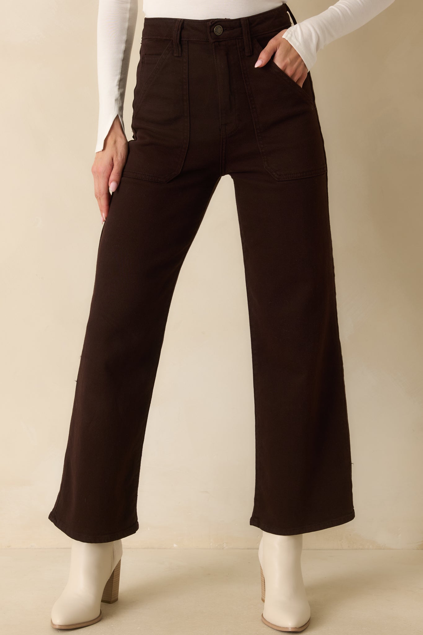 A cropped front view showing the front patch pockets and waistband detail.