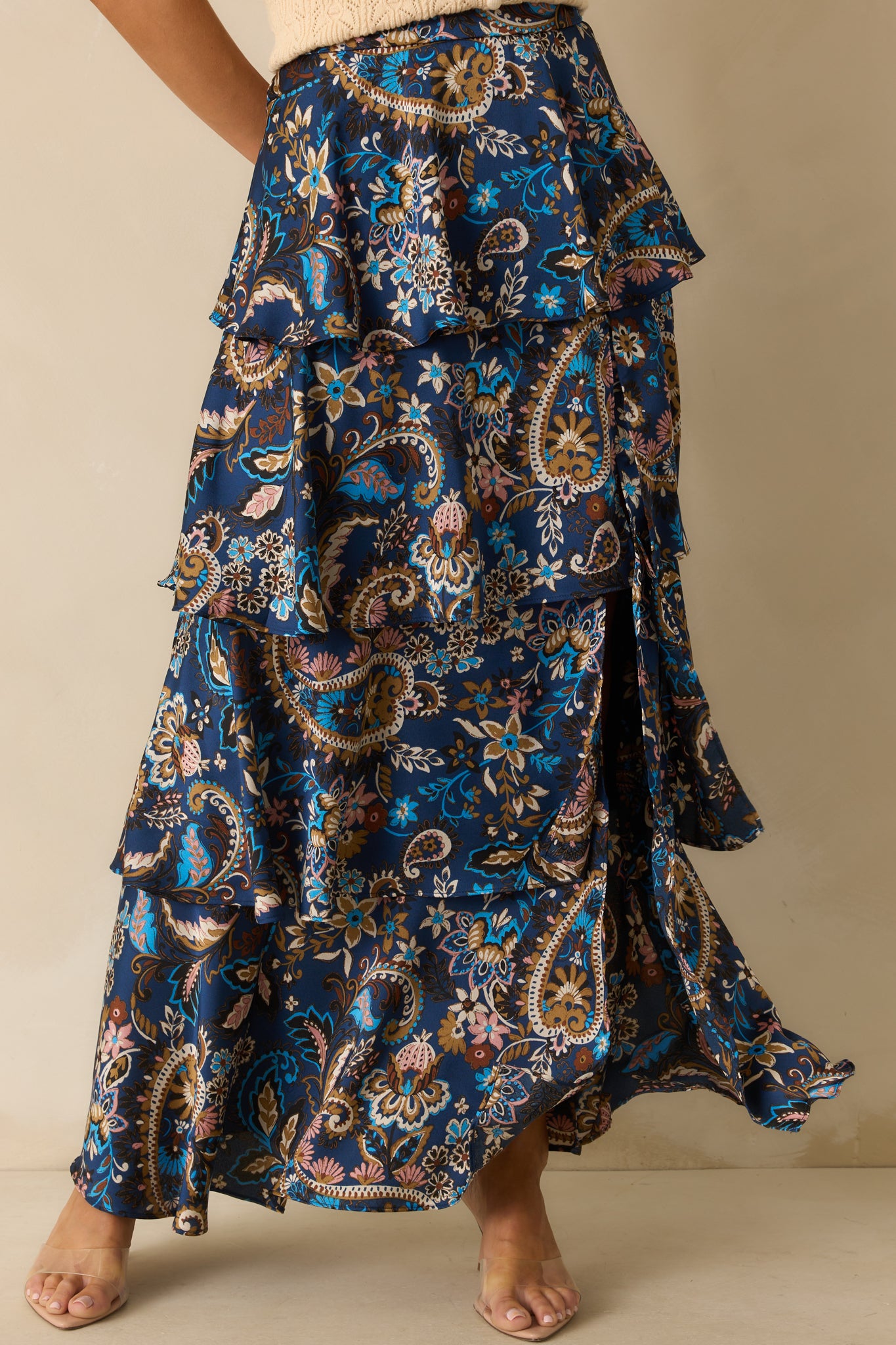 Cropped focus on the glossy satin fabric and flowing silhouette.