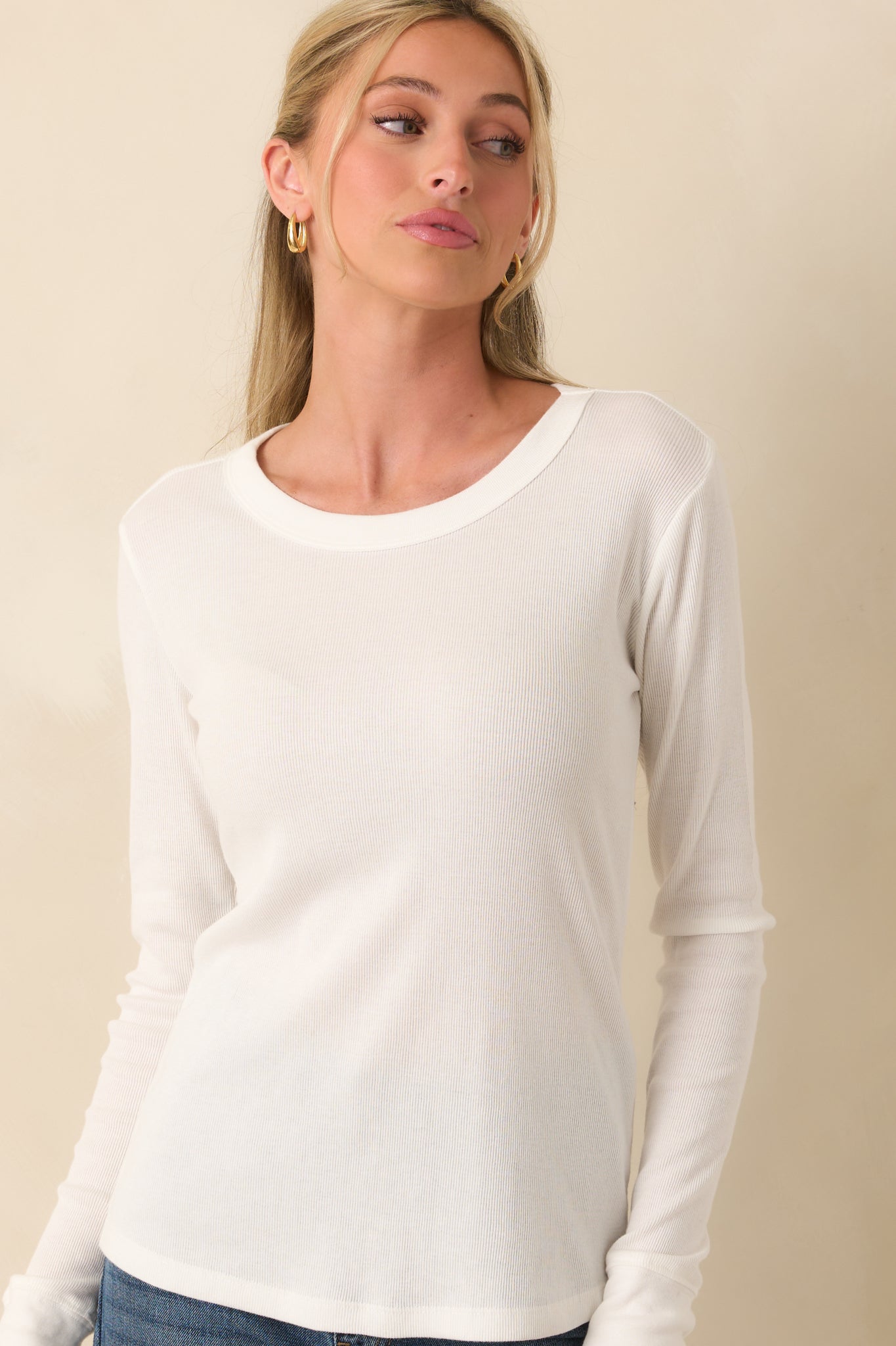 Cropped image of the midsection emphasizing the ribbed texture and even cut of the hem.