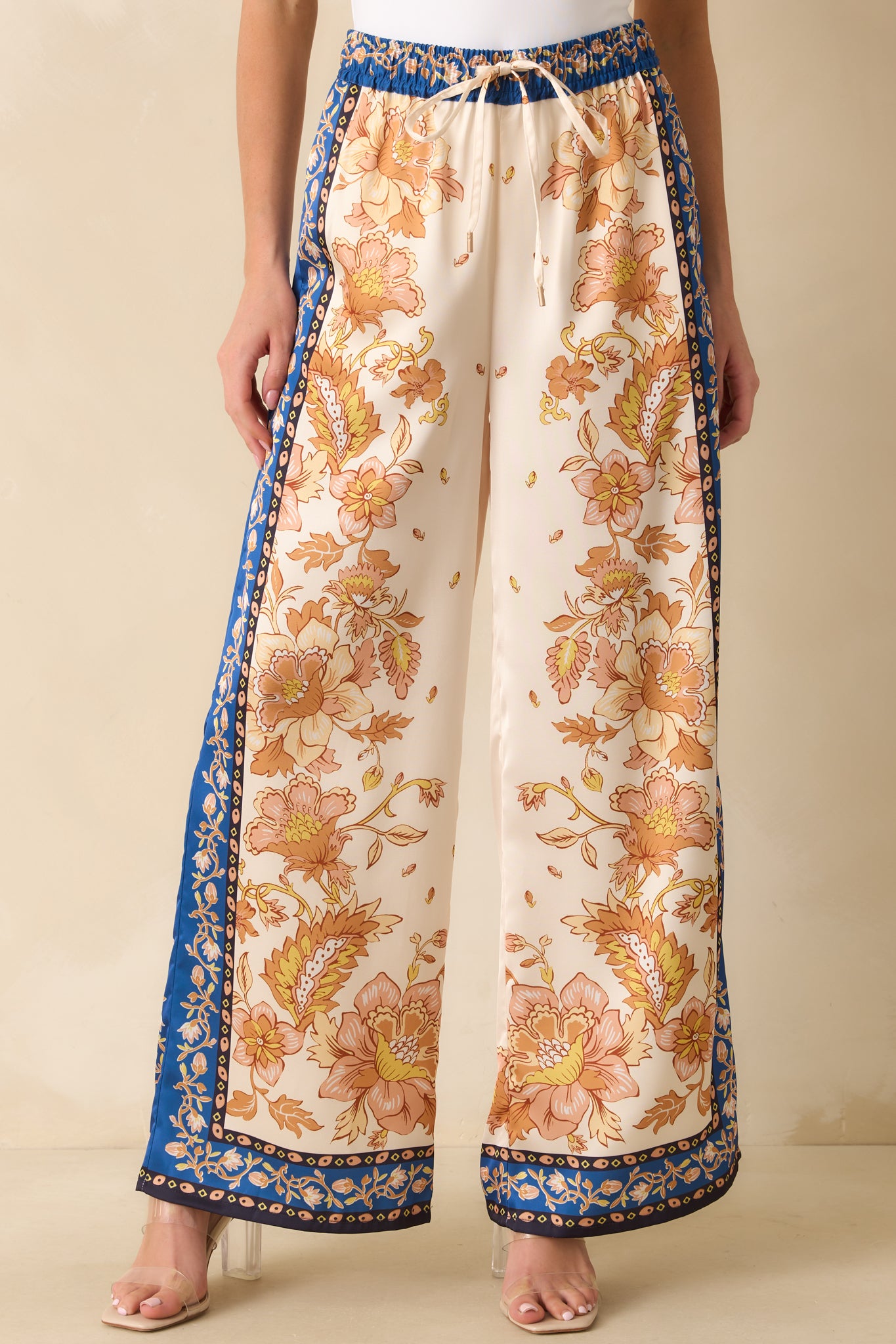 Cropped image highlighting the wide-leg silhouette and contrast navy border trim along the hem.