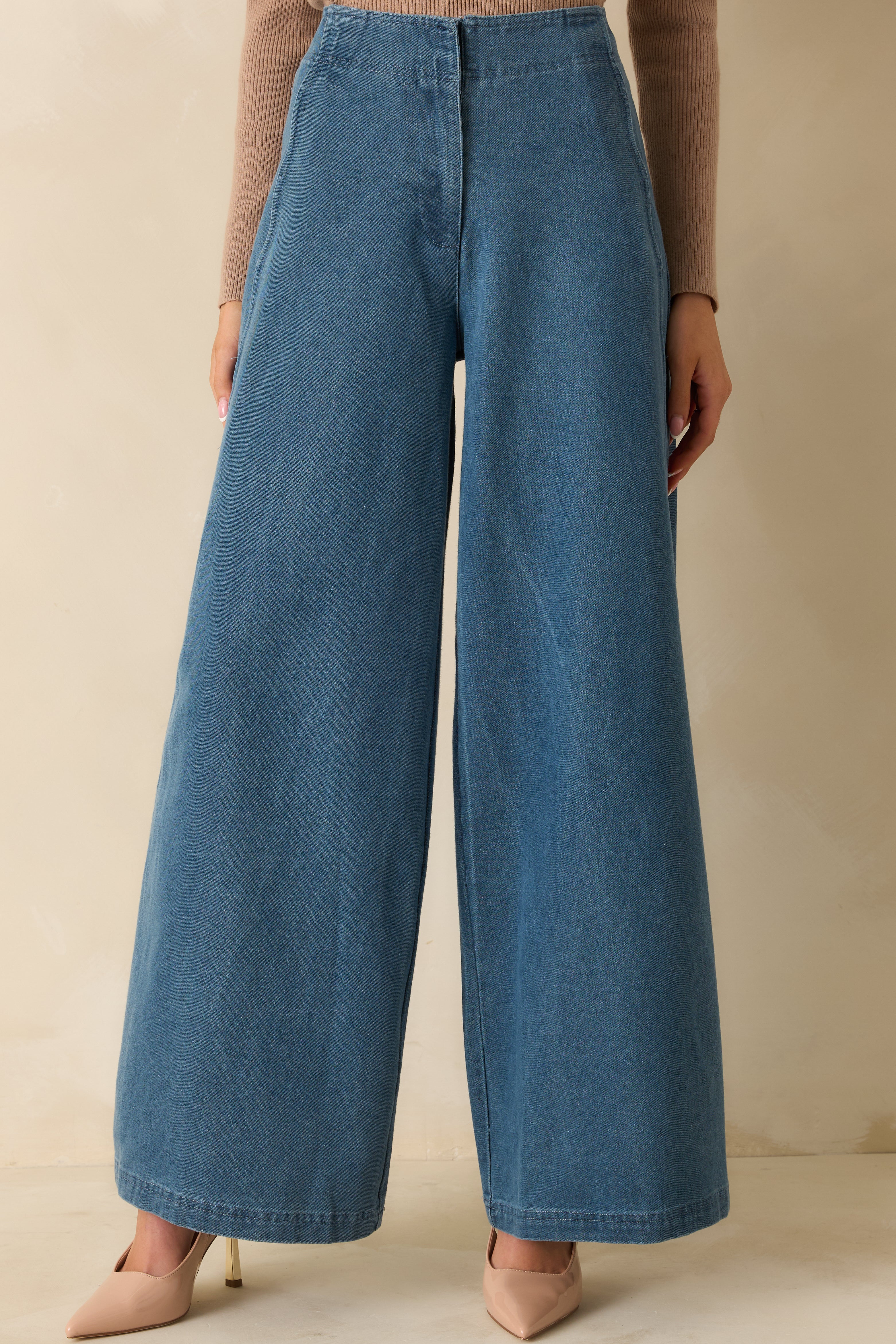 Cropped lower view showcasing the wide leg shape and even medium wash tone.