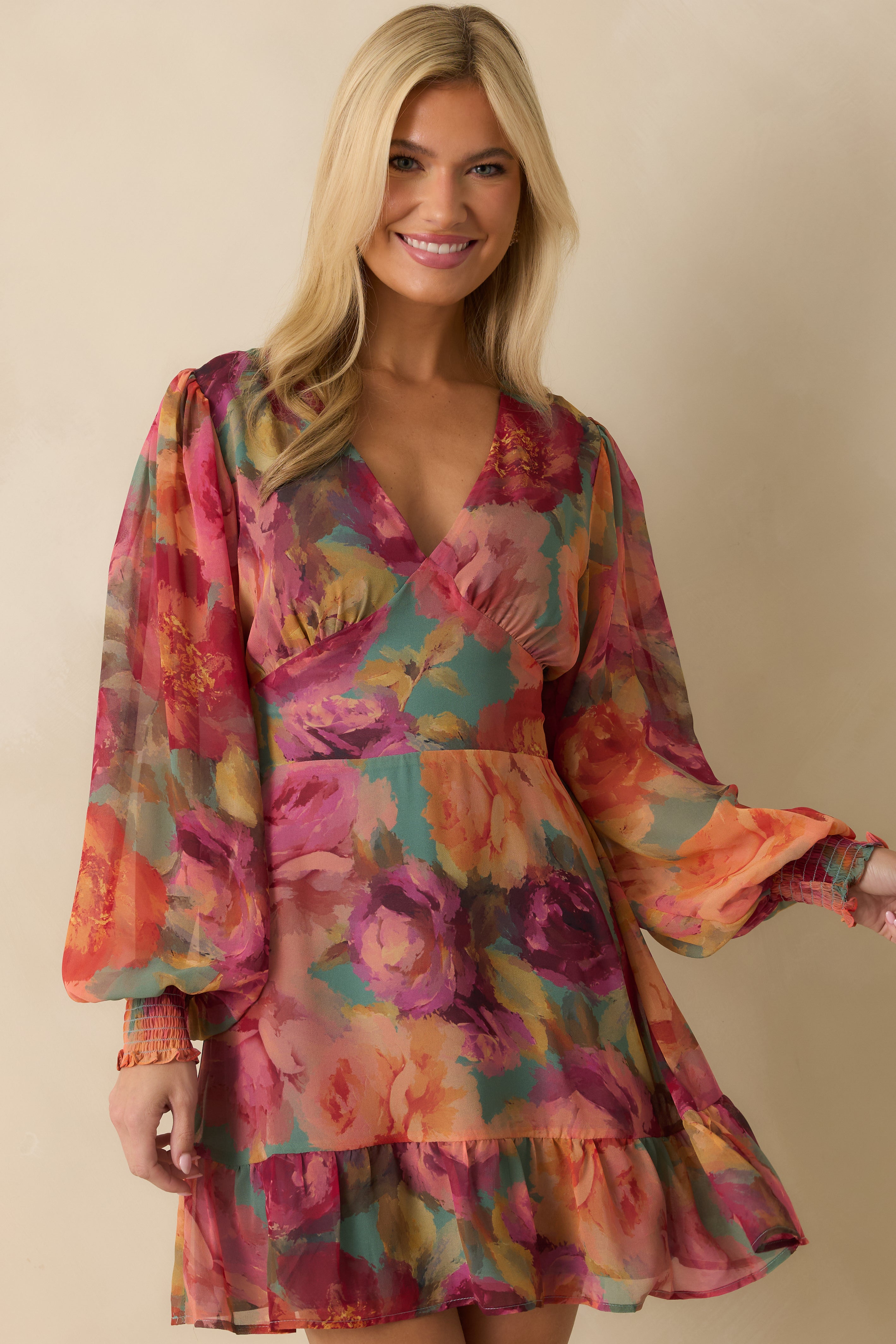 Cropped lower view focusing on the tiered mini hem and delicate floral pattern.