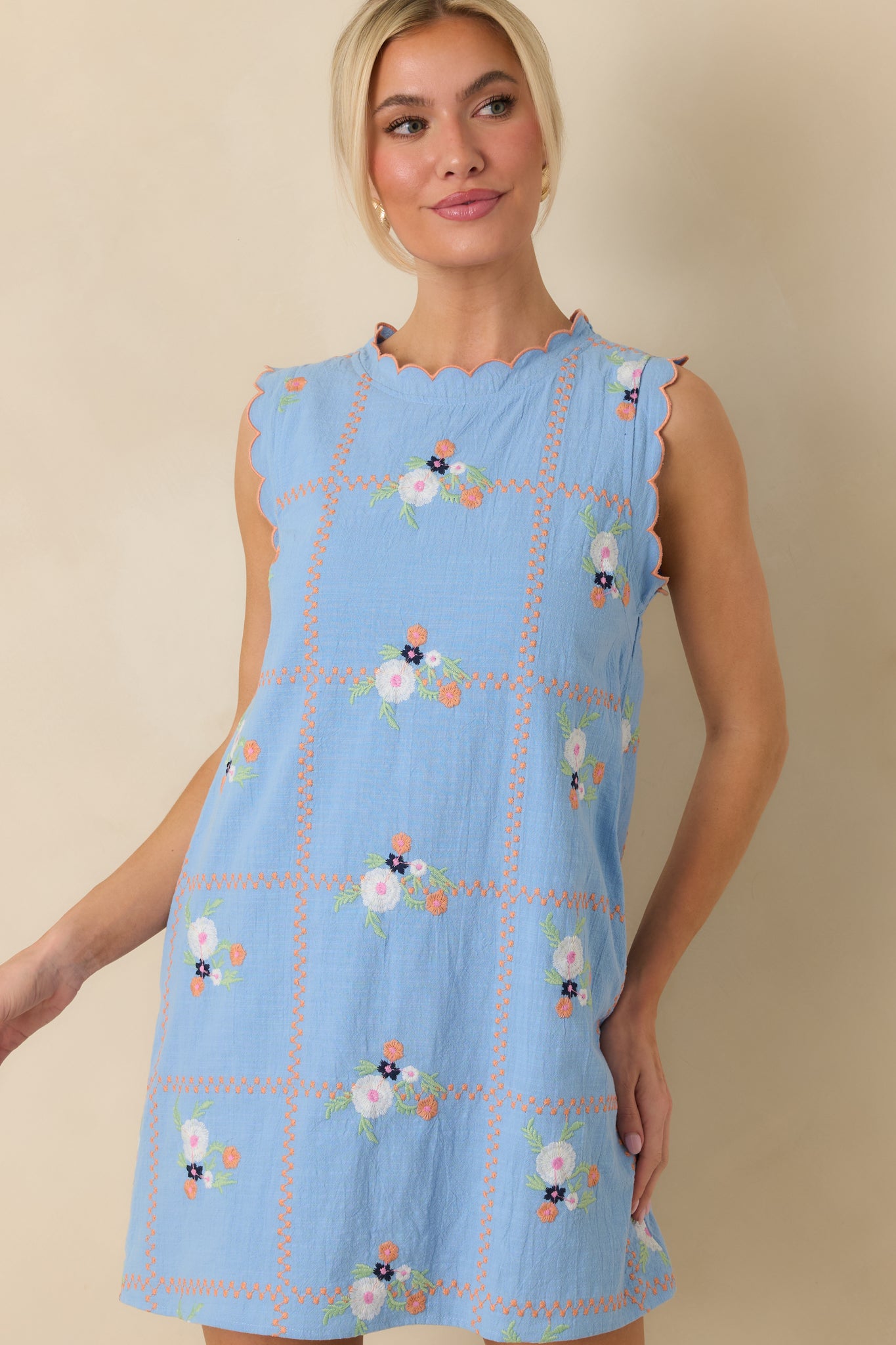 Cropped perspective showing the sleeveless silhouette and straight fit through the torso.