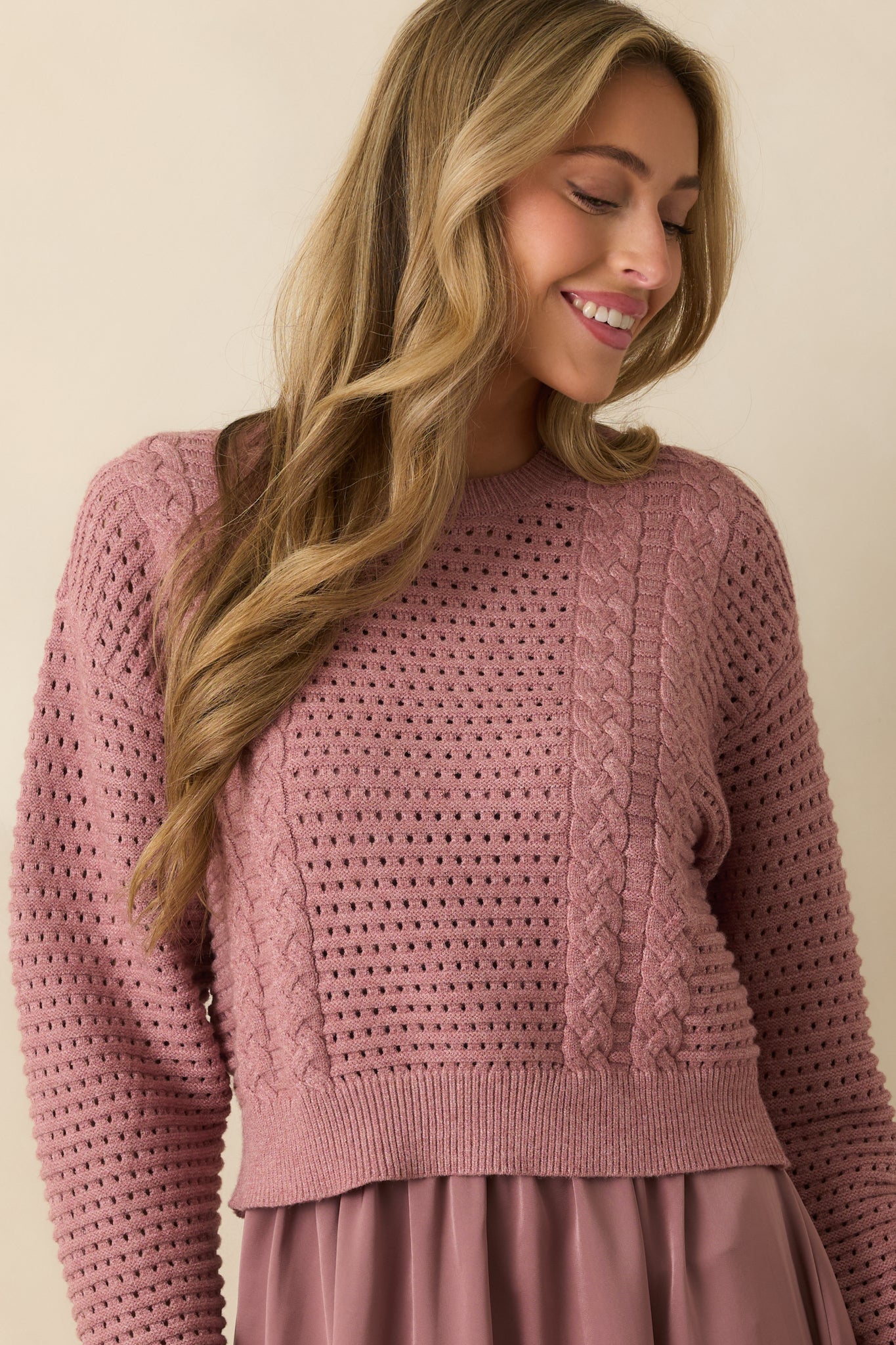 Cropped detail of the satin dress’s elastic waist and soft sheen, showing the fluid drape of the fabric.