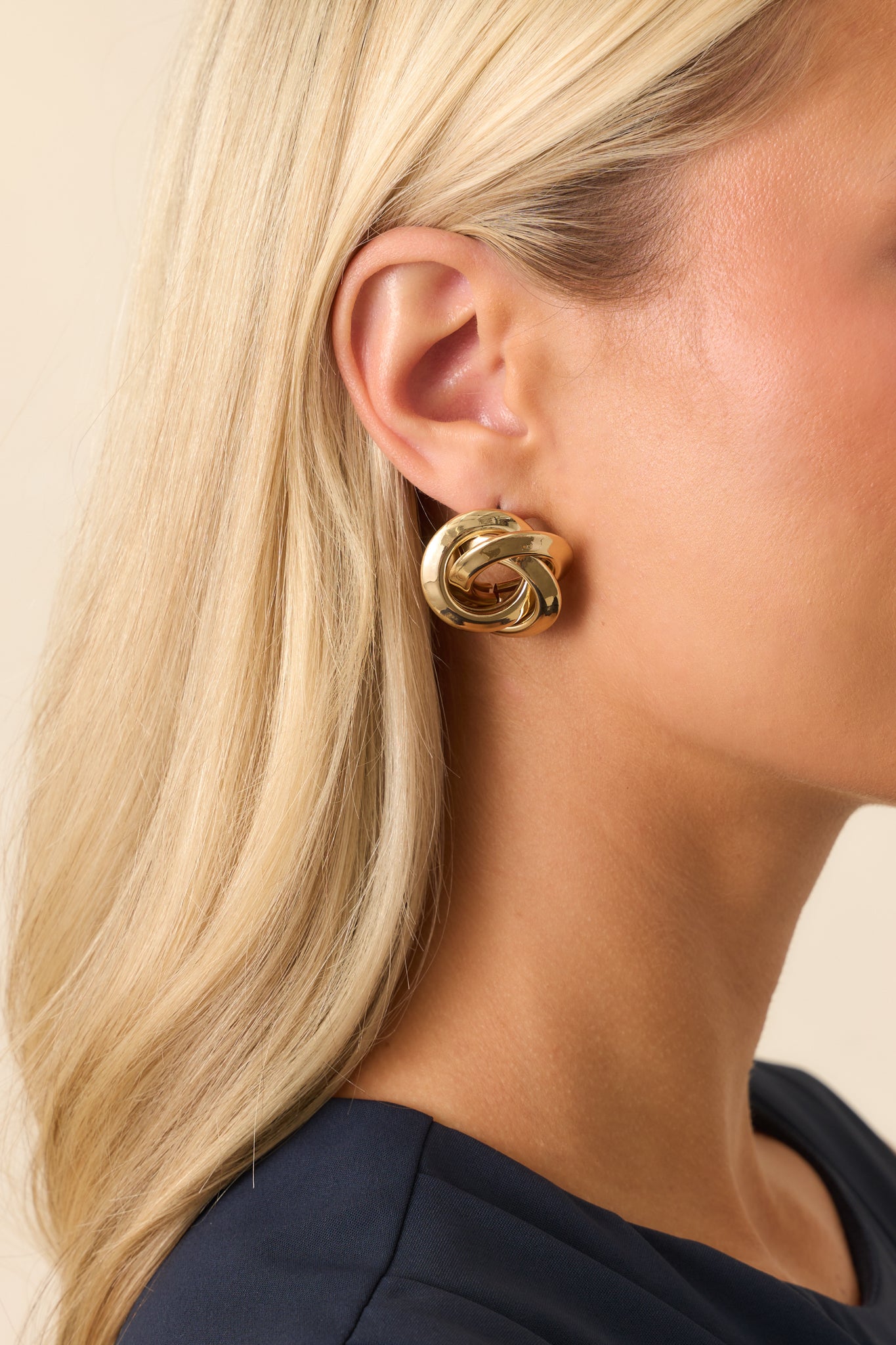 Angled cropped shot showing the depth of the hollow center and the reflective gold finish.