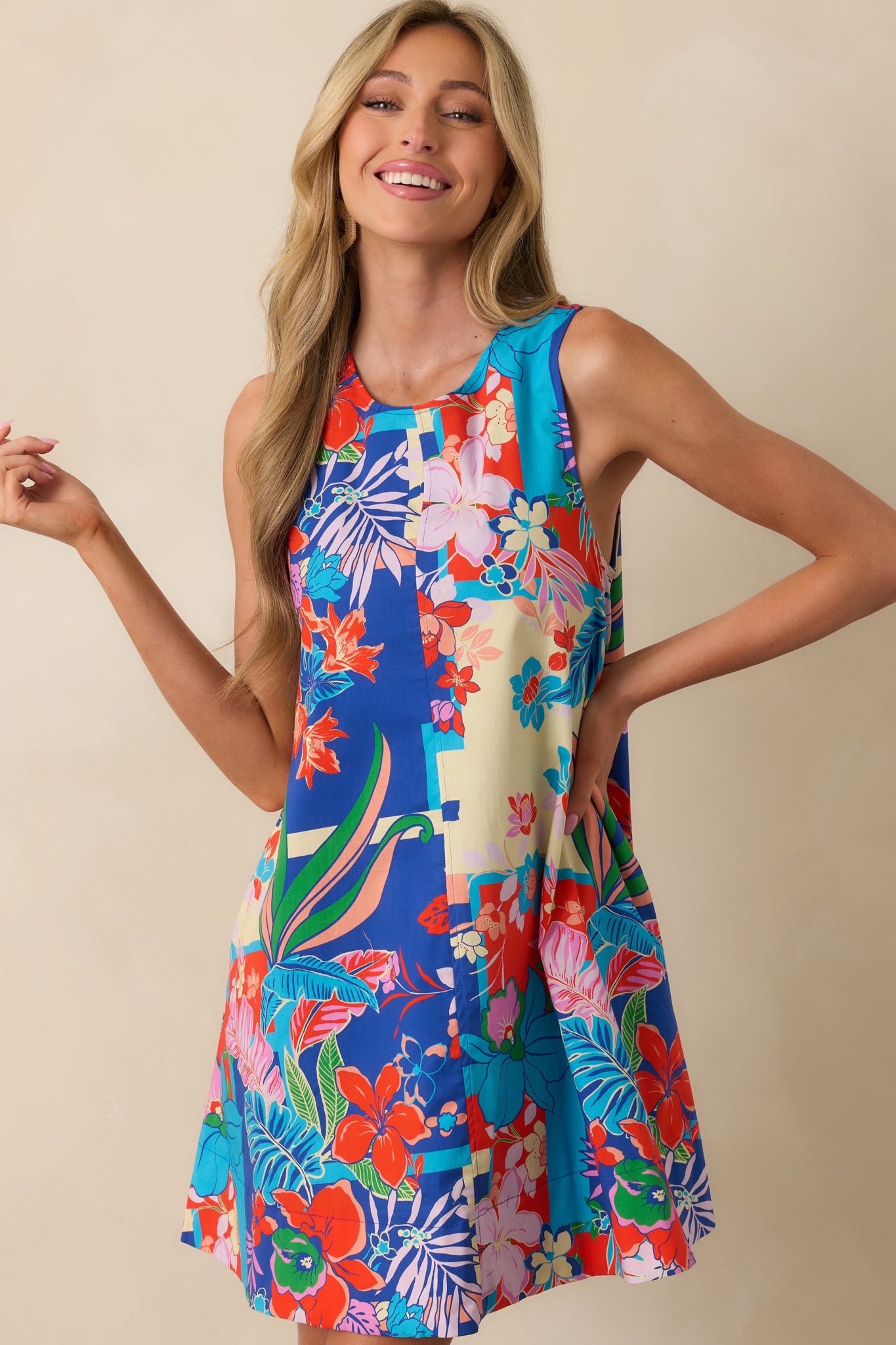 Cropped view focusing on the neckline and upper bodice of the floral blue mini dress with a round neckline.