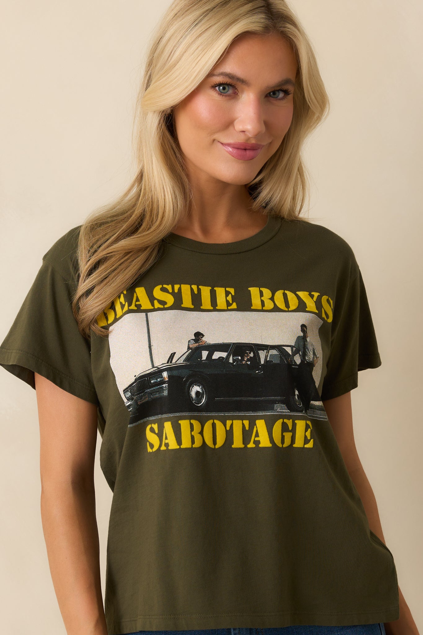 A cropped front view emphasizing the bold band image and distressed yellow “Beastie Boys Sabotage” text.