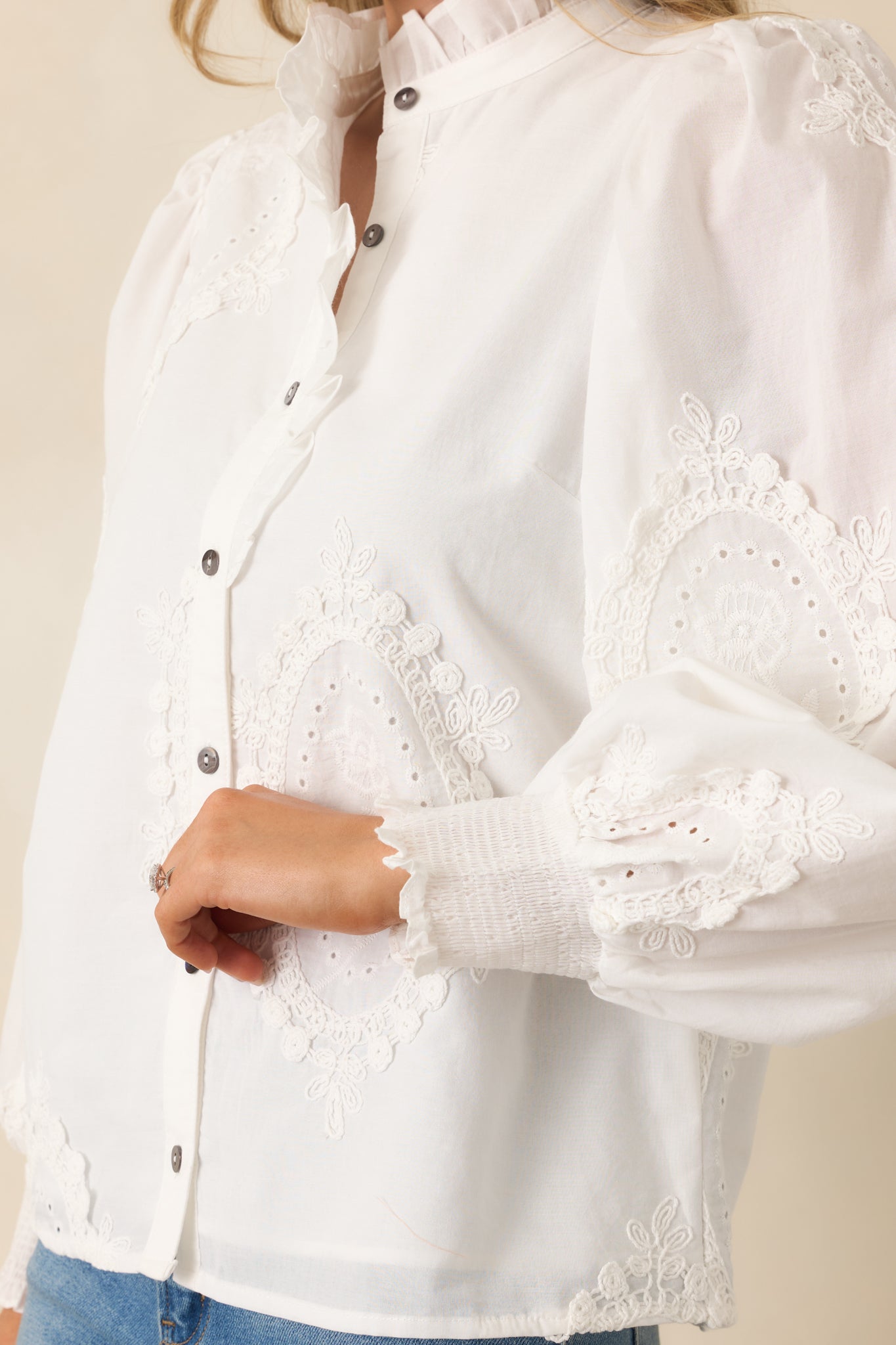 Cropped front view emphasizing the long sleeves with elasticized cuffs.