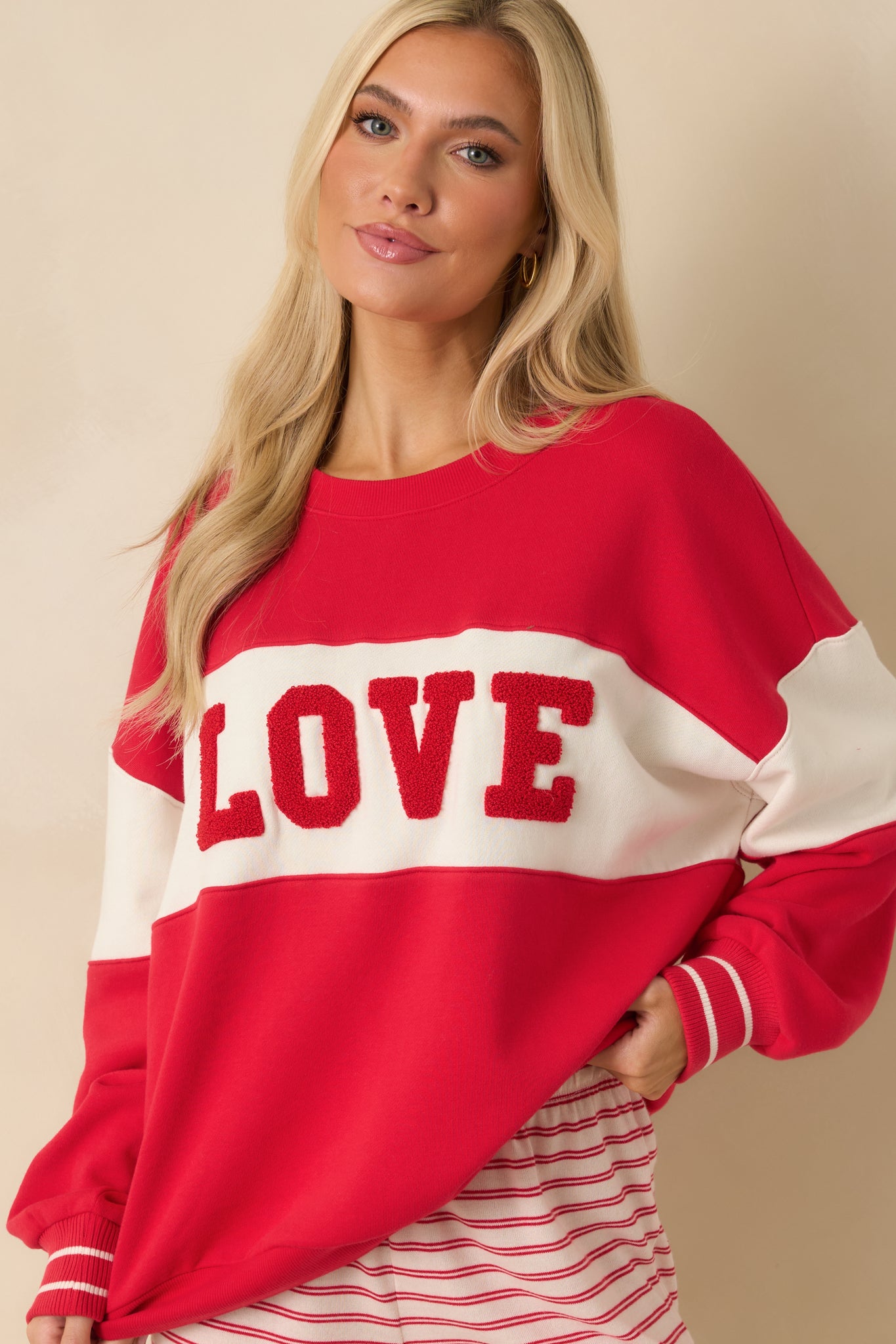 Cropped view emphasizing the striped cuffs and soft fleece fabric