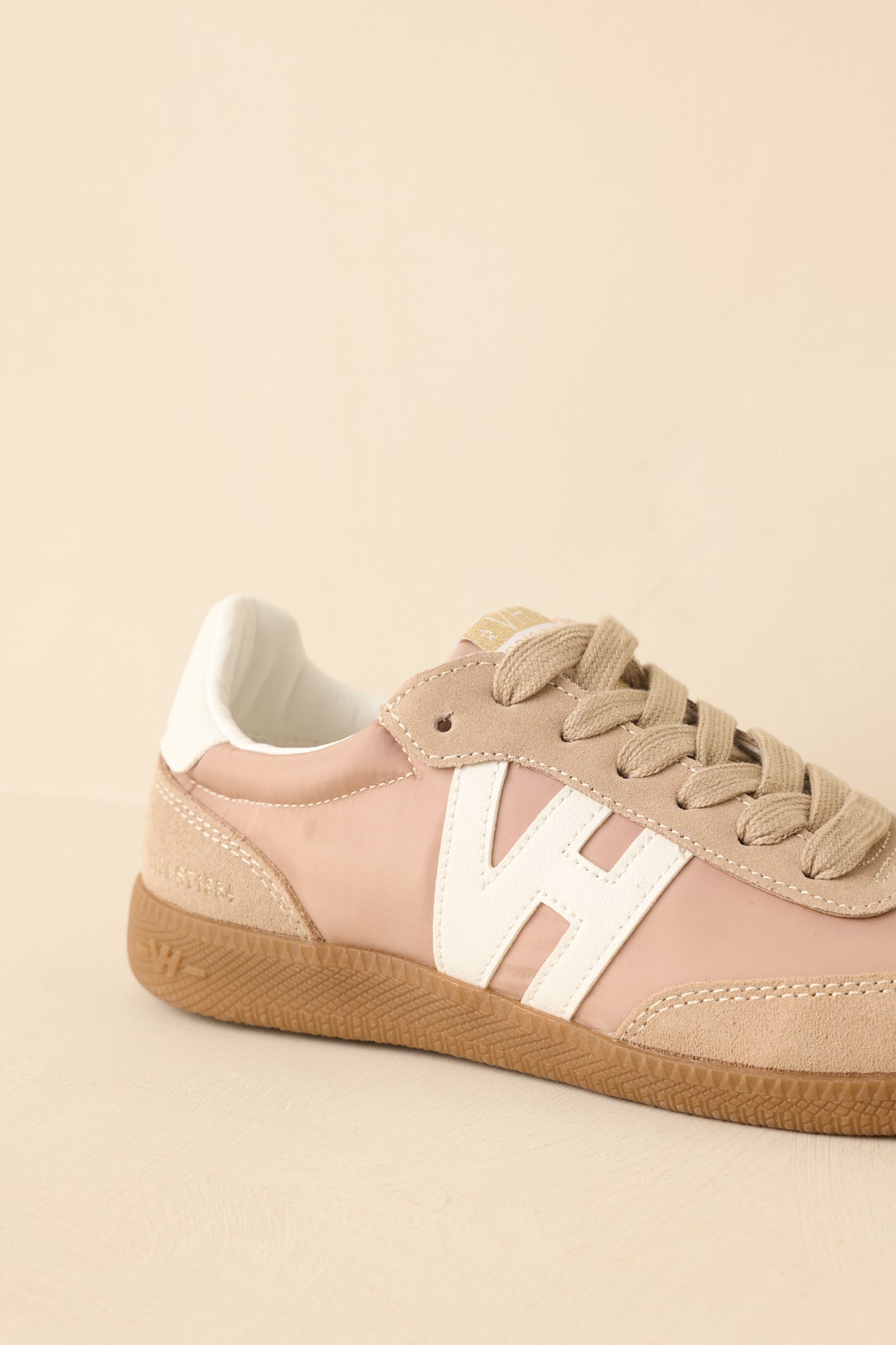 Cropped-in view emphasizing the upper design and clean finish around the eyelets and tongue.