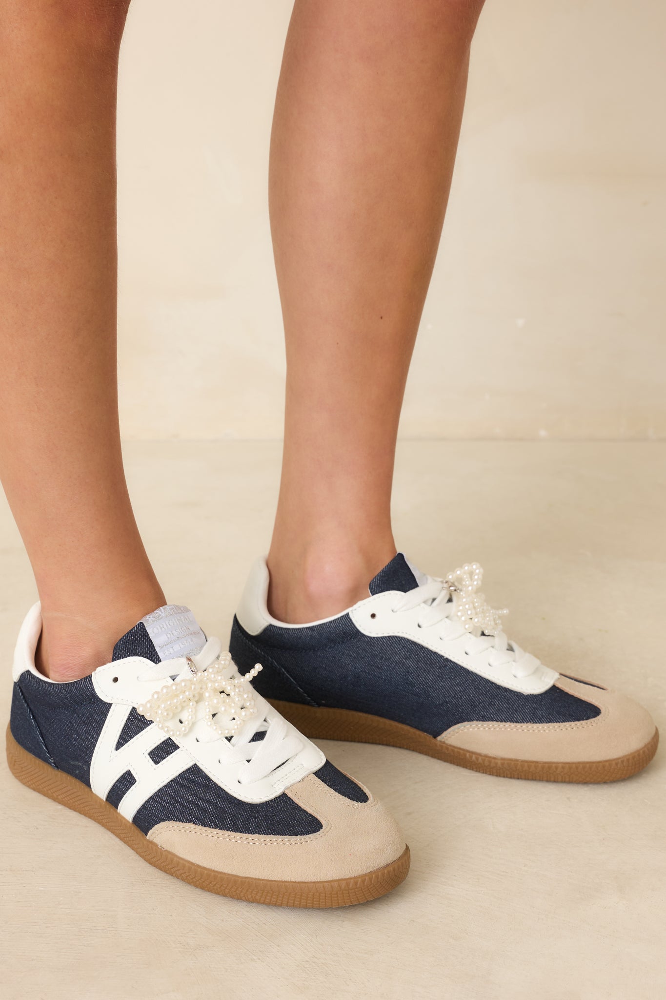 Cropped view focusing on suede overlays and mixed-texture paneling.