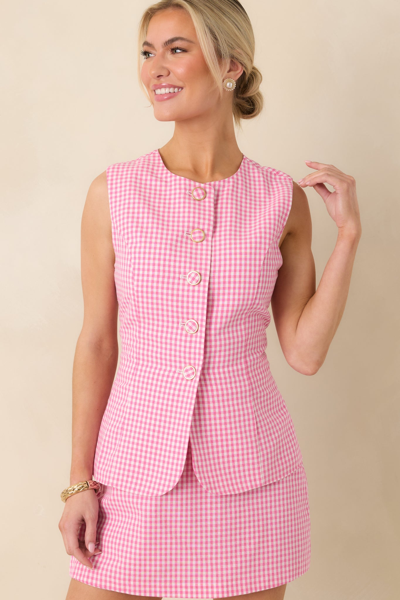 Cropped front view focusing on the gingham pattern and button-front closure details.