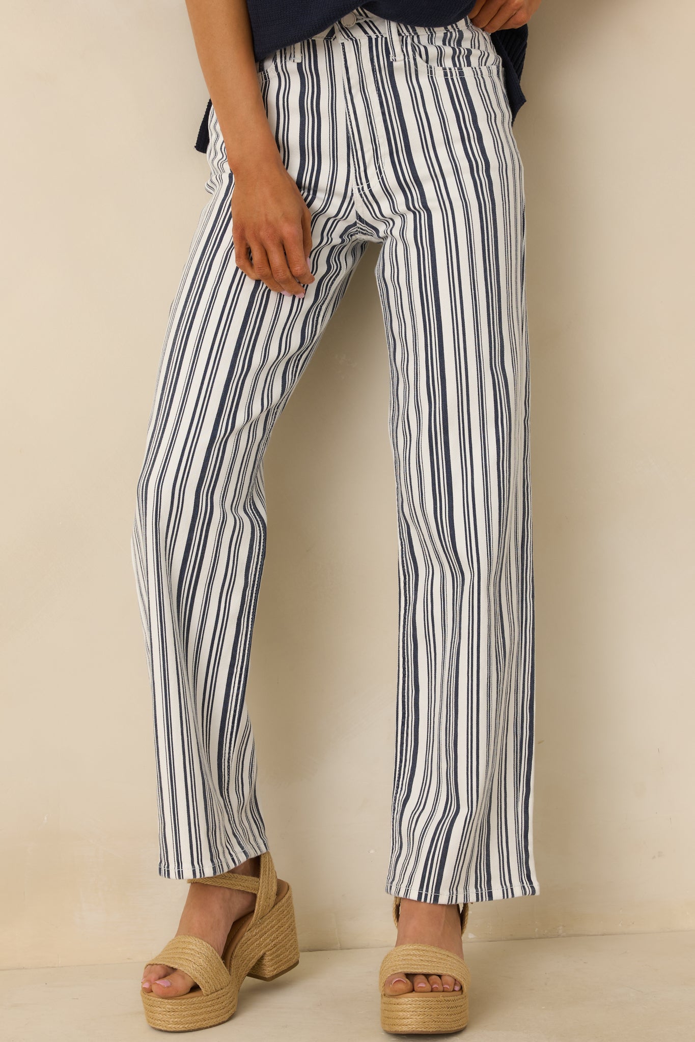 Cropped view emphasizing the functional front pockets and vertical stripe detailing.
