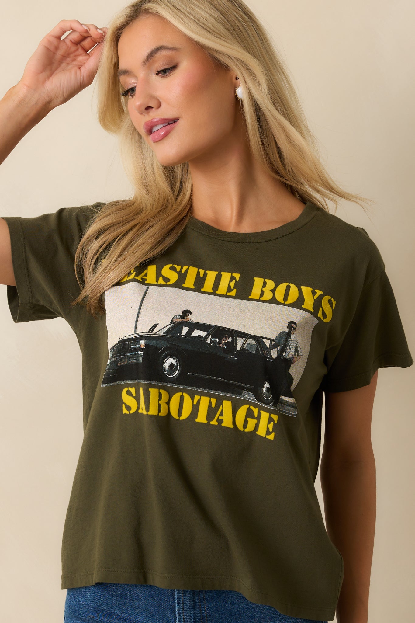 A front cropped view highlighting the straight hem and relaxed drape of the tee.