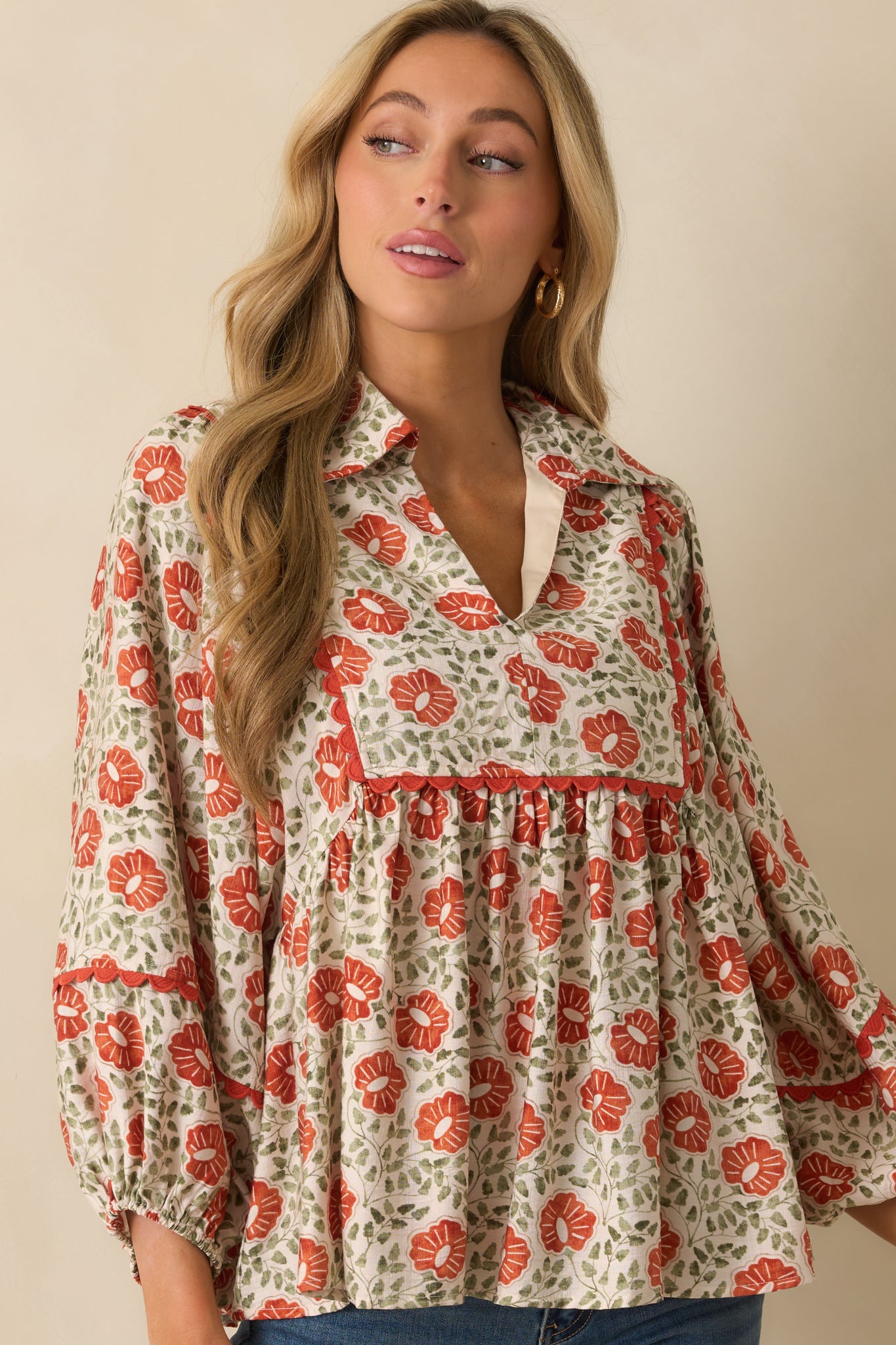 A cropped image showing the vibrant multicolor flowers and relaxed fit across the chest.