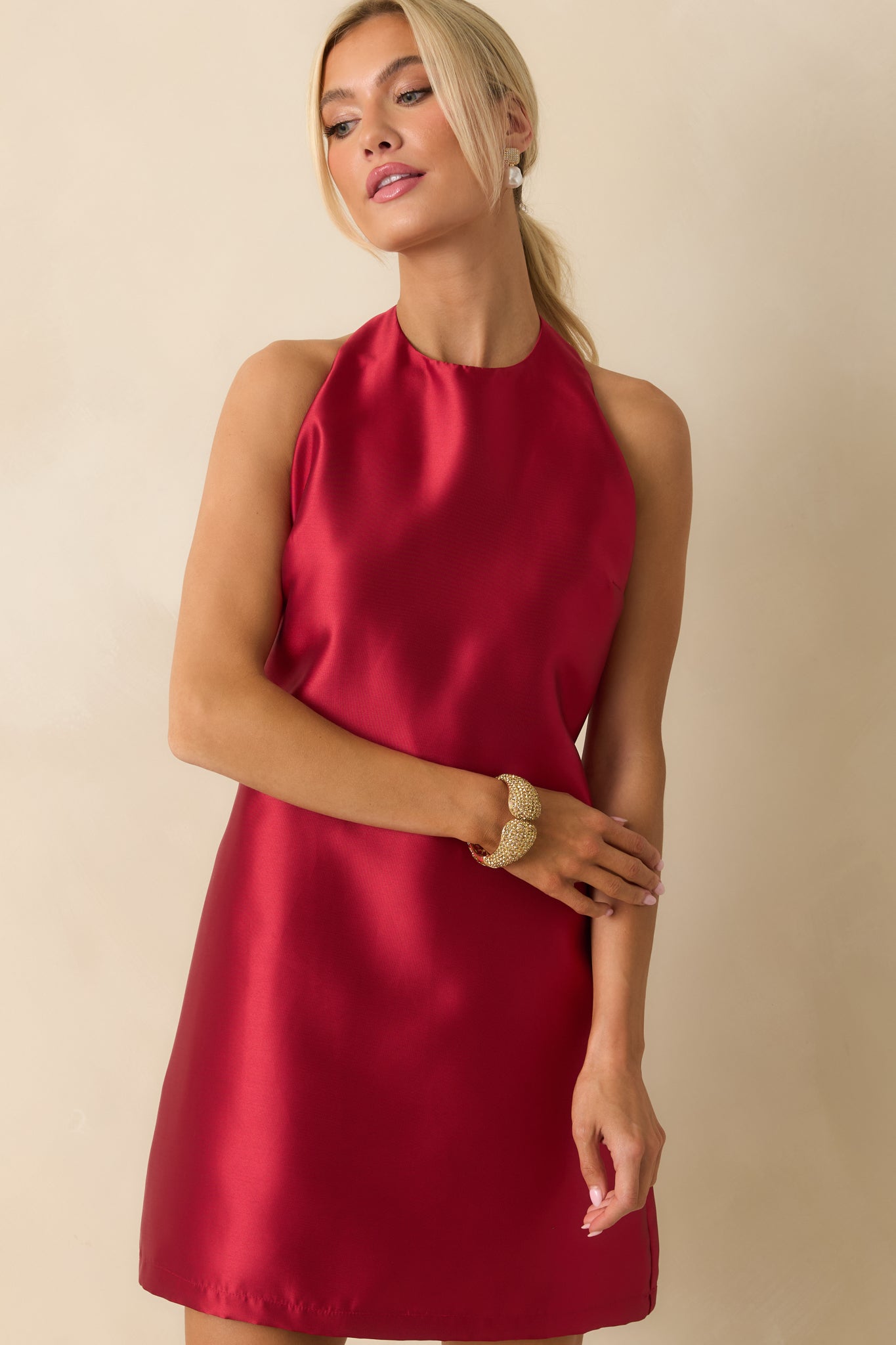 Cropped view highlighting the A-line shape and luxurious red satin texture.