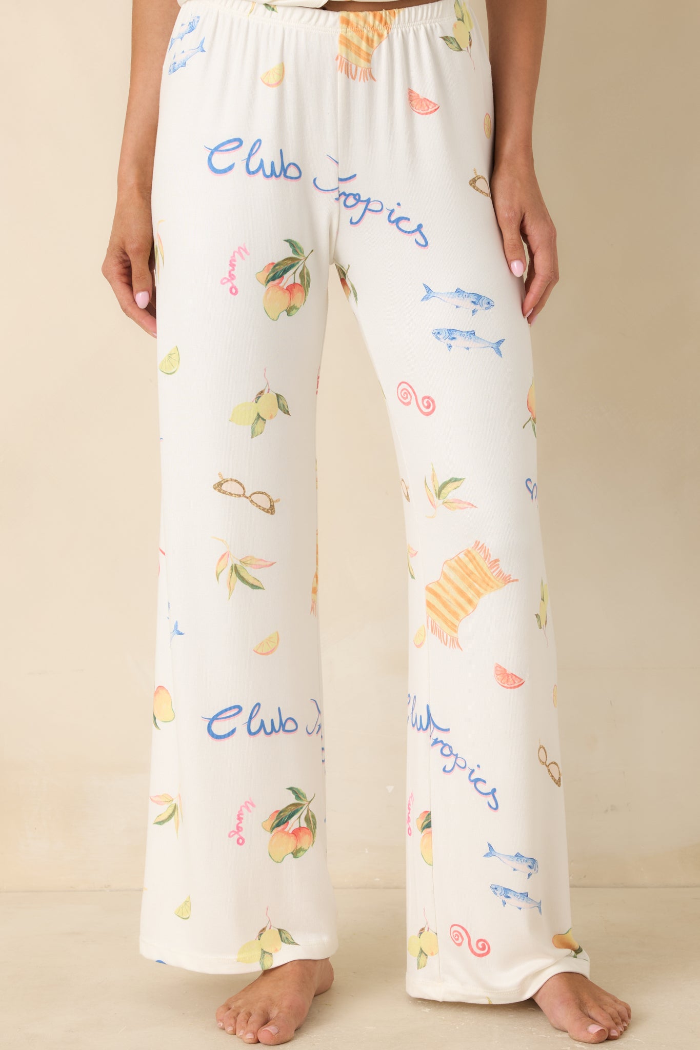 Cropped front view of tropical lounge pants highlighting soft elastic waistband and wide-leg drape