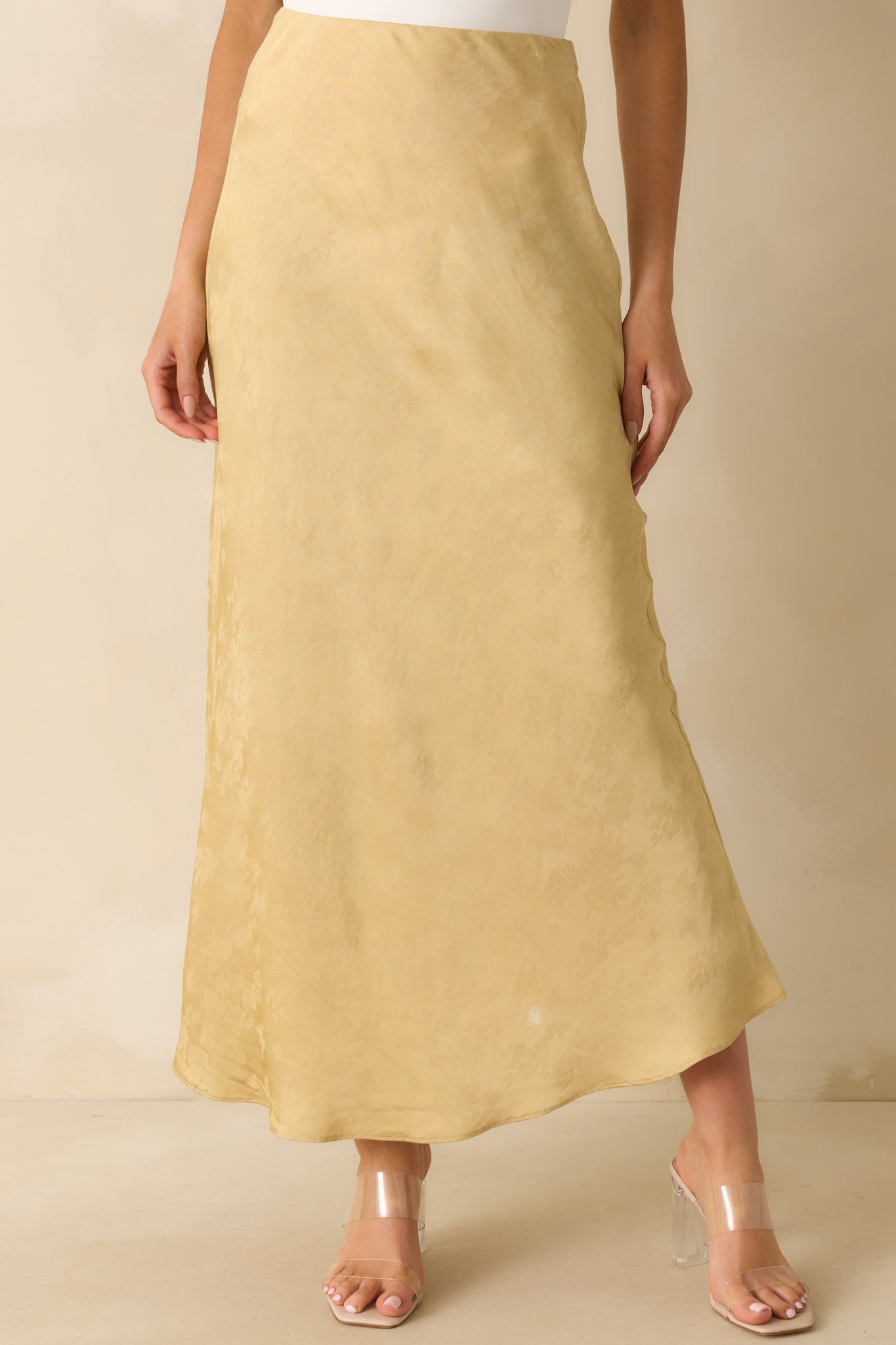 Cropped view emphasizing the smooth satin texture and bias-cut flow.