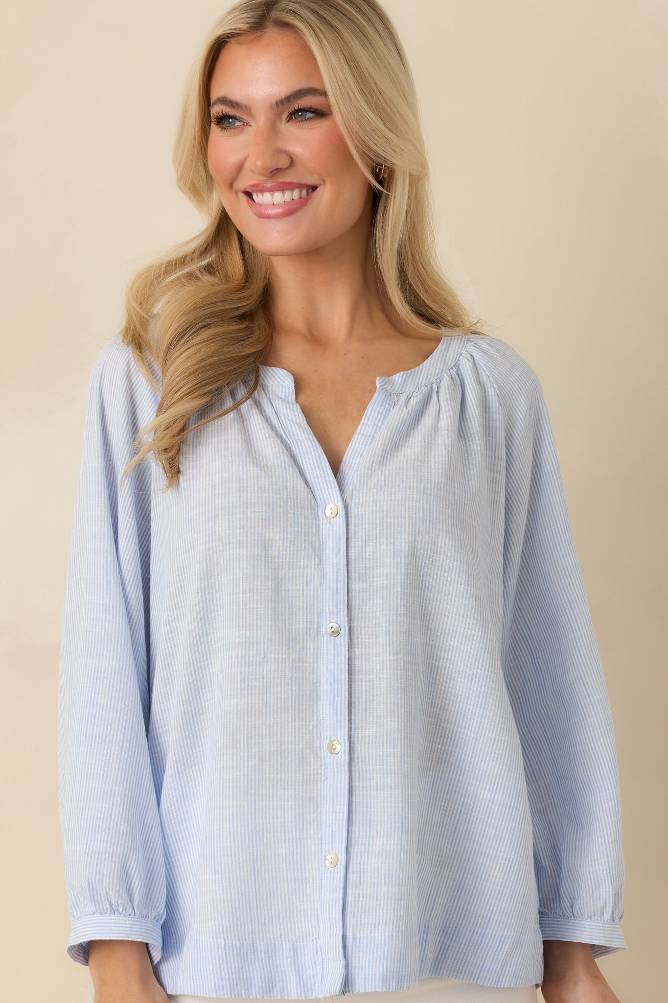 Front cropped view of the blouse showing raglan sleeve construction and relaxed fit through the torso.