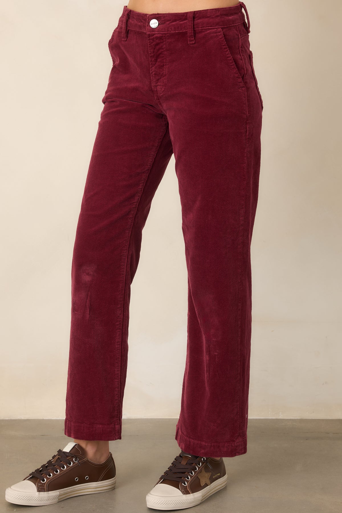 Cropped wine corduroy pants featuring a clean straight-leg cut and practical slanted pockets at the front.