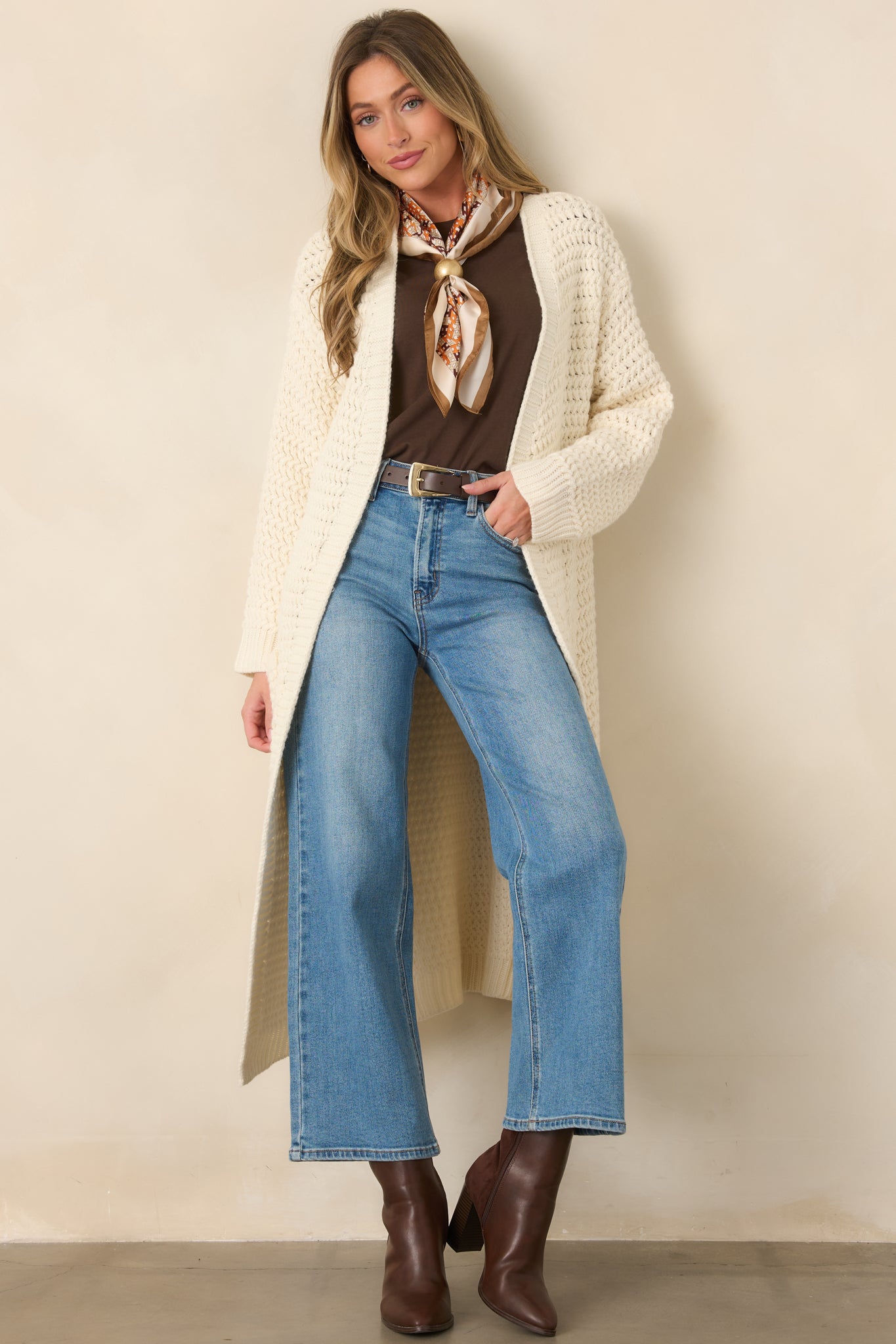 Dark chocolate top crafted from a smooth cotton-lyocell blend with a relaxed fit, crew neckline, cap-style sleeves, and slightly cropped length.