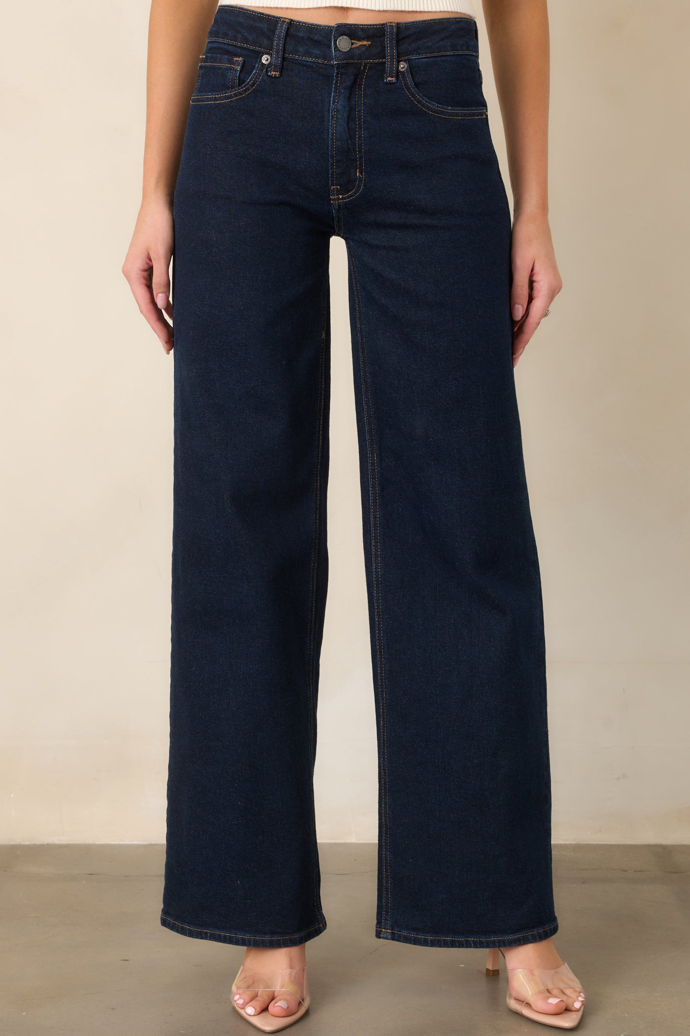 Dark denim showcasing the classic five-pocket design and clean structured construction through the front.