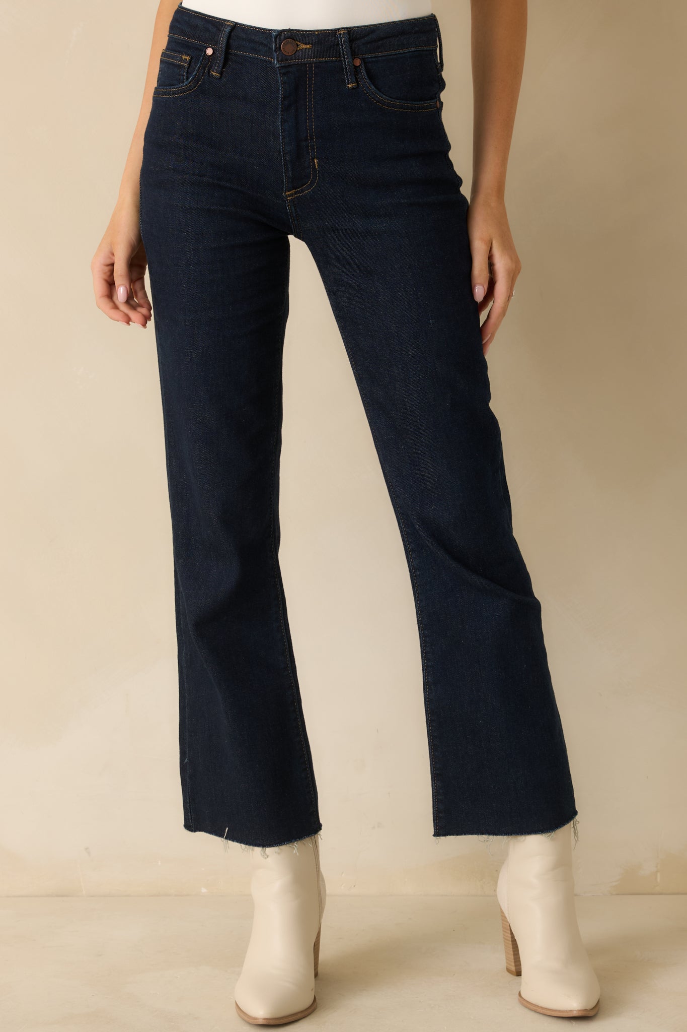Front view of dark wash denim showing the smooth fit through the hips and thighs.