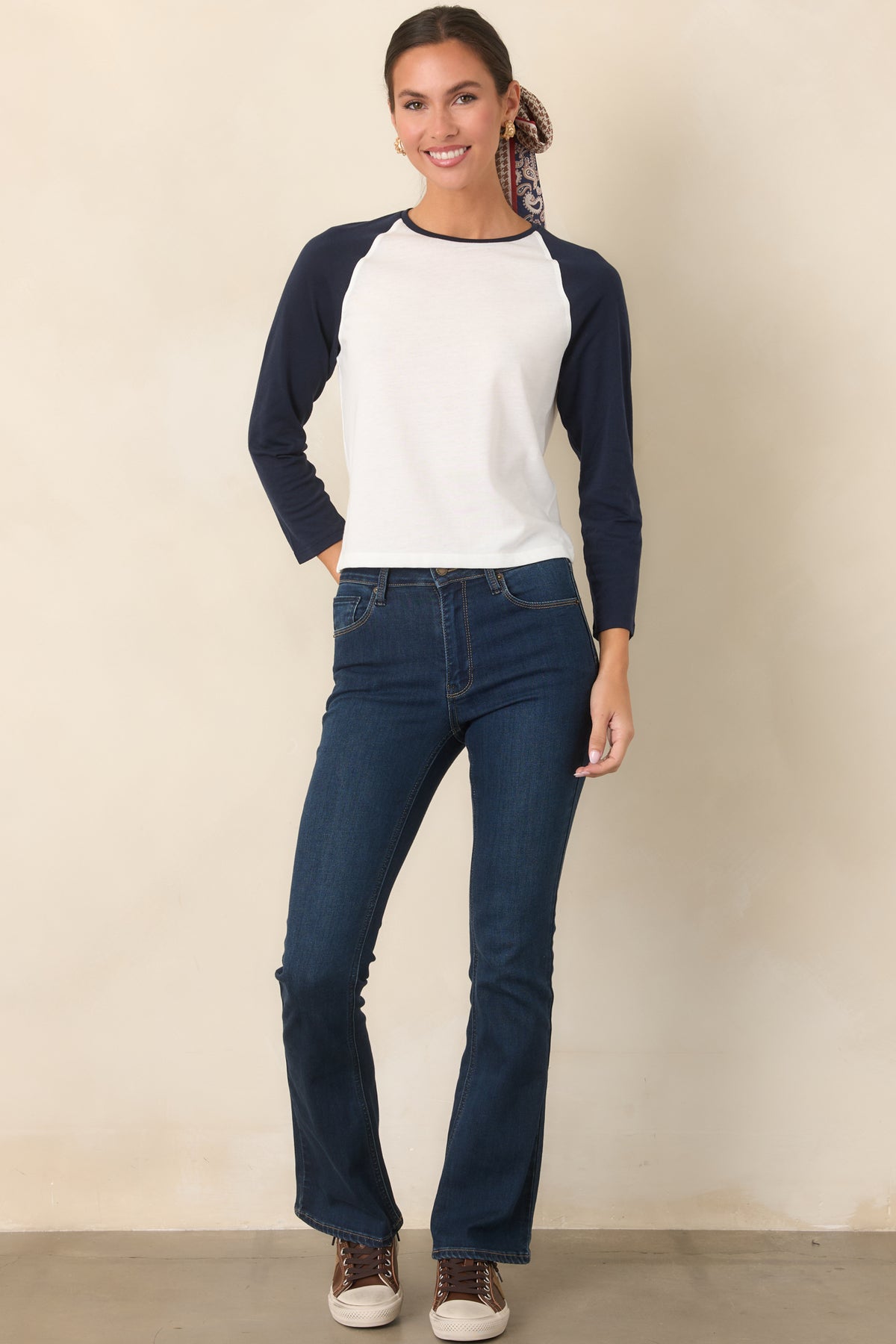 High-rise dark denim jeans with a subtle flare silhouette and comfortable stretch construction.
