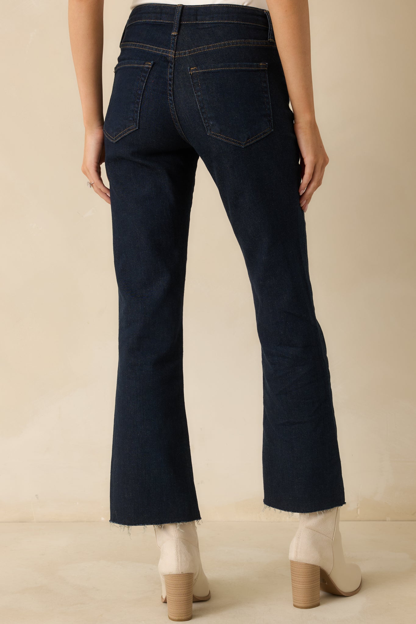 Back view of the dark wash jeans featuring classic pocket stitching and a flattering high-rise cut.
